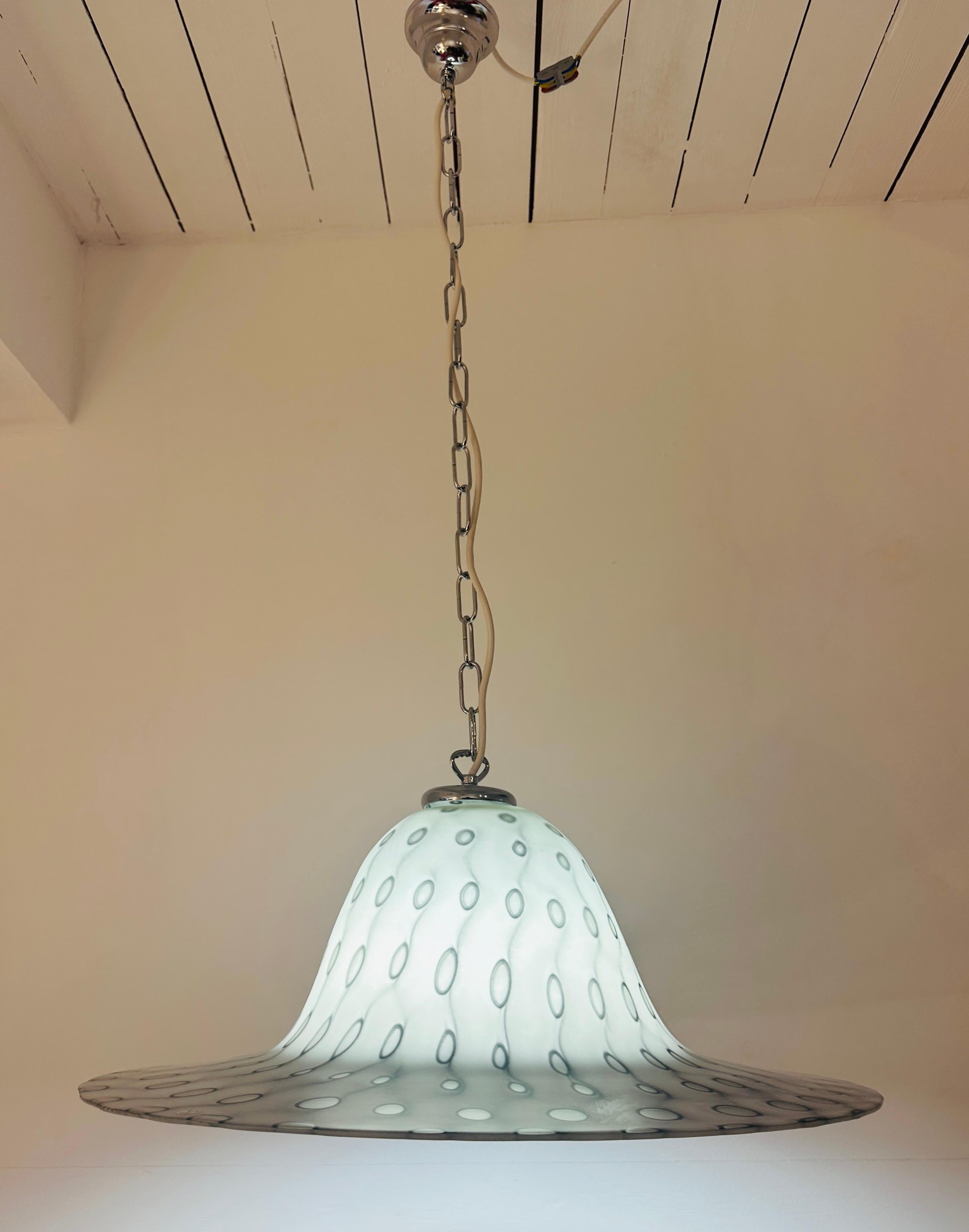 A stunning 1970s Modernist German Peill & Pützler bell-shaped hanging ceiling glass pendant light.  Designed by German designer Aloys Ferdinand Gangkofner. 

The heavy, and thick, mouth-blown, grey silky matt, glass shade features a darker grey