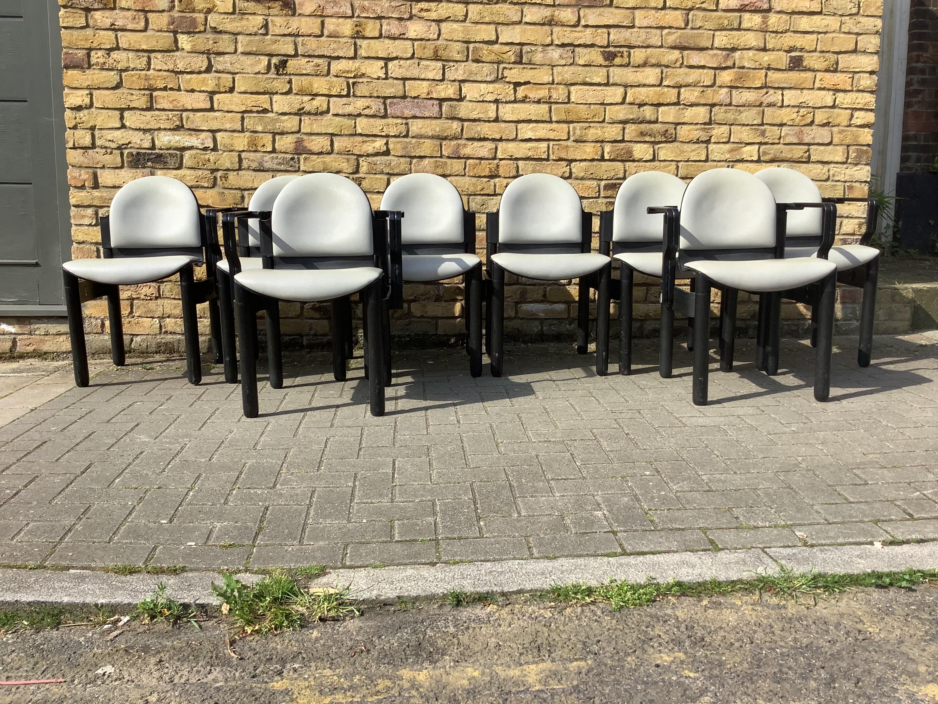 A set of 8 stackable chairs by Gerd Lange in 1973 and produced by Thonet
Each chair feature an ash bentwood frame ,solid ash legs ,black lacquered 
Aluminum armrests ,and PVC seats chairs and stamped underneath Thonet 
4 cravers and 4 chairs