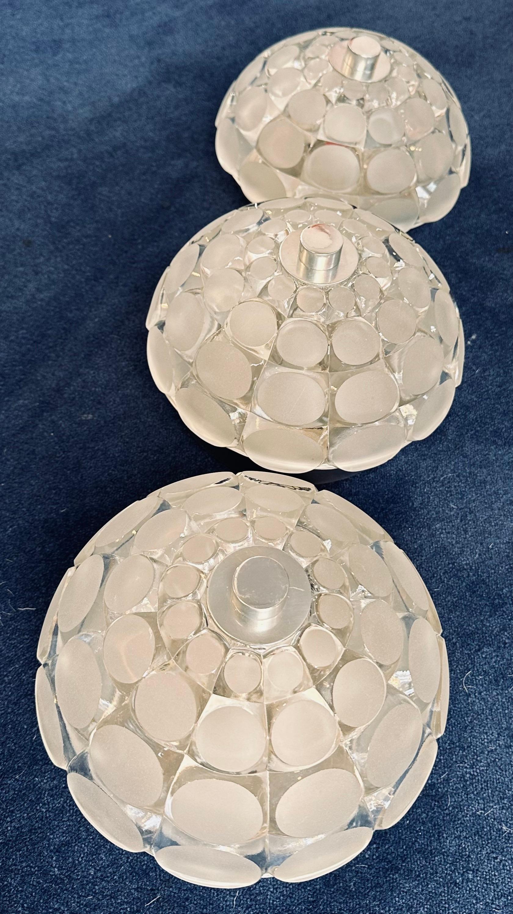 Unusual 1970s German Peill & Putzler wall lights which could also be used as ceiling flush mounts for a small room perhaps a bathroom/cloackroom or along a hallway with a low ceiling. The circular glass shade is secured to the aluminium fitting with