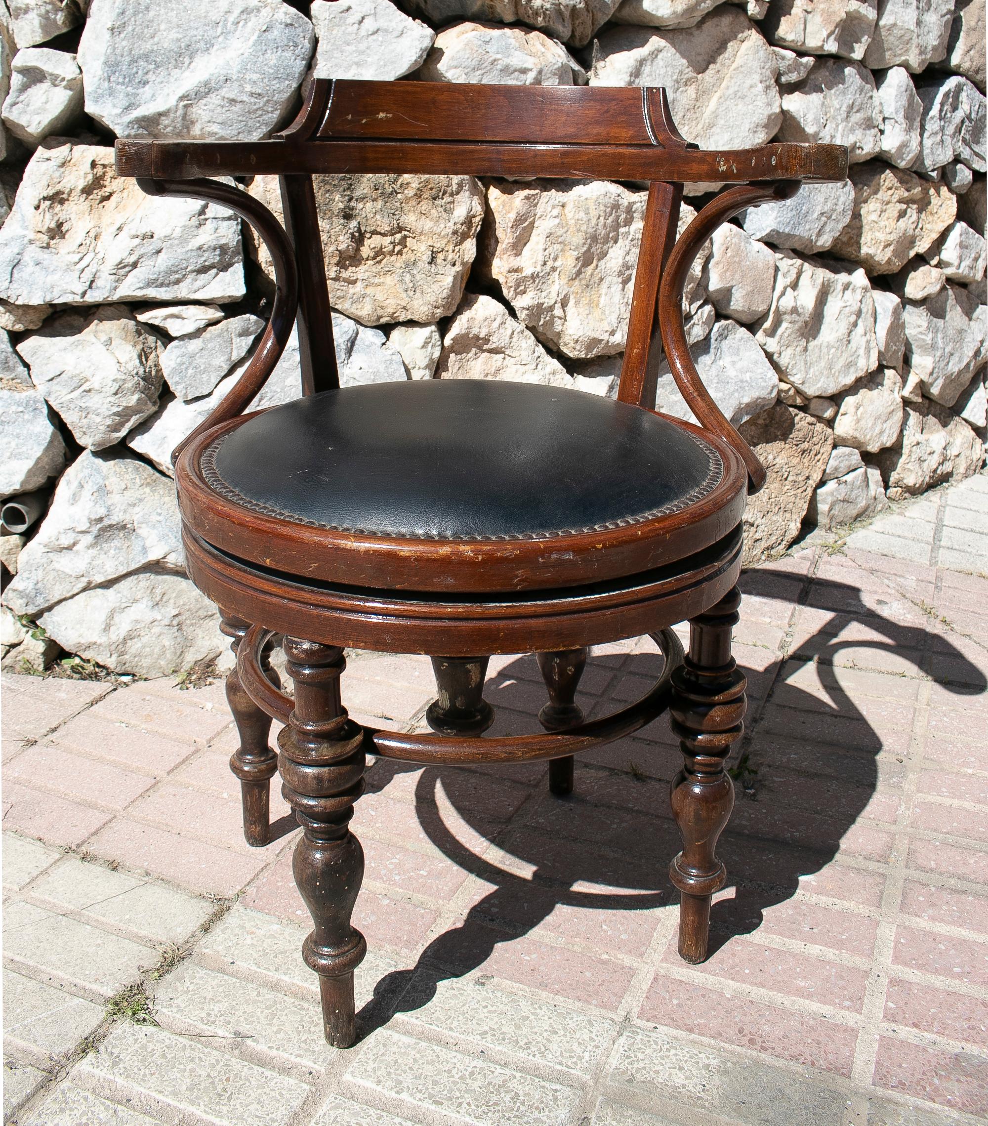 1970s German swivel office chair with leather seat.