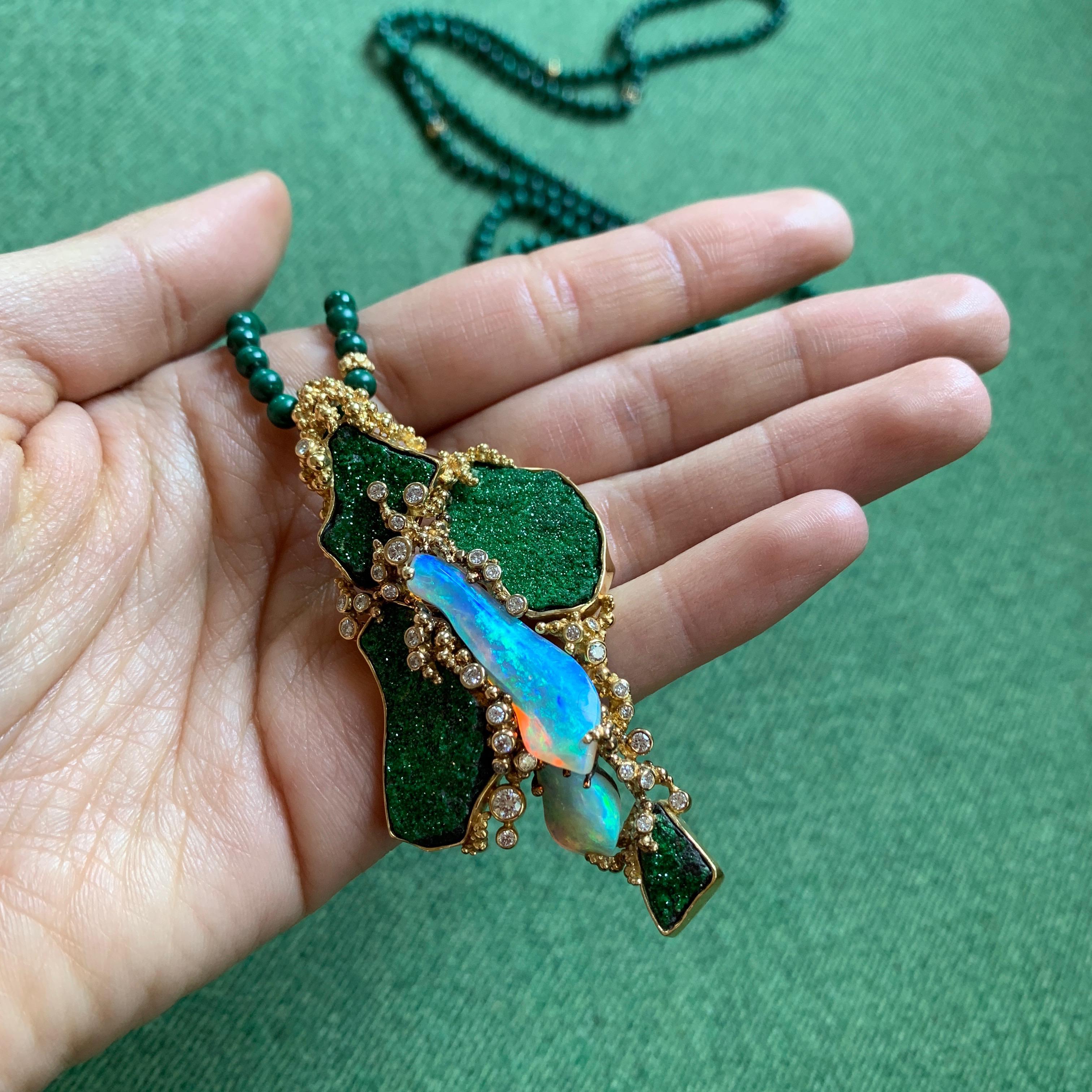 An exquisite diamond, malachite, opal and 18 karat gold long necklace, with detachable brooch/pendant, by the important Swiss jeweler Gilbert Albert, c. 1970.

The necklace measures approximately 15.5