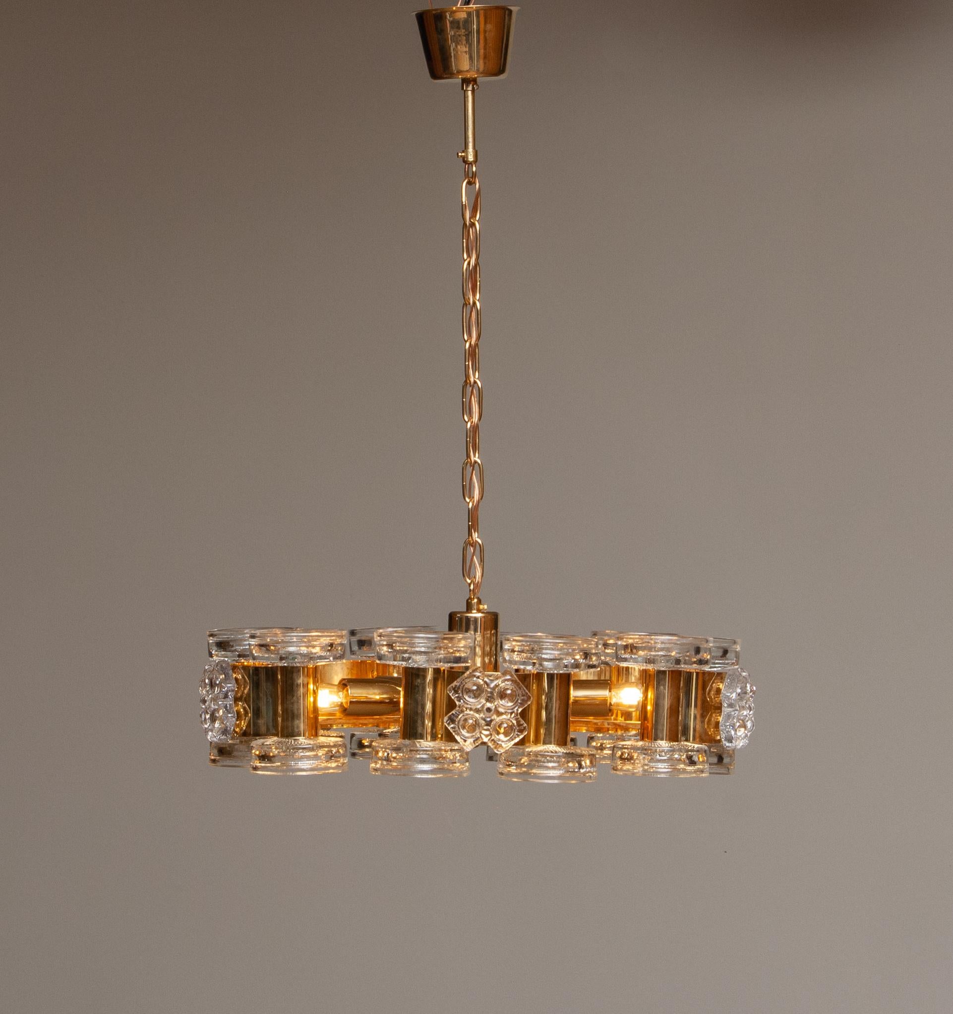 Swedish 1970s Gilt Chandelier with Ten Candle Holders and Five Screw Bulbs by Orrefors For Sale