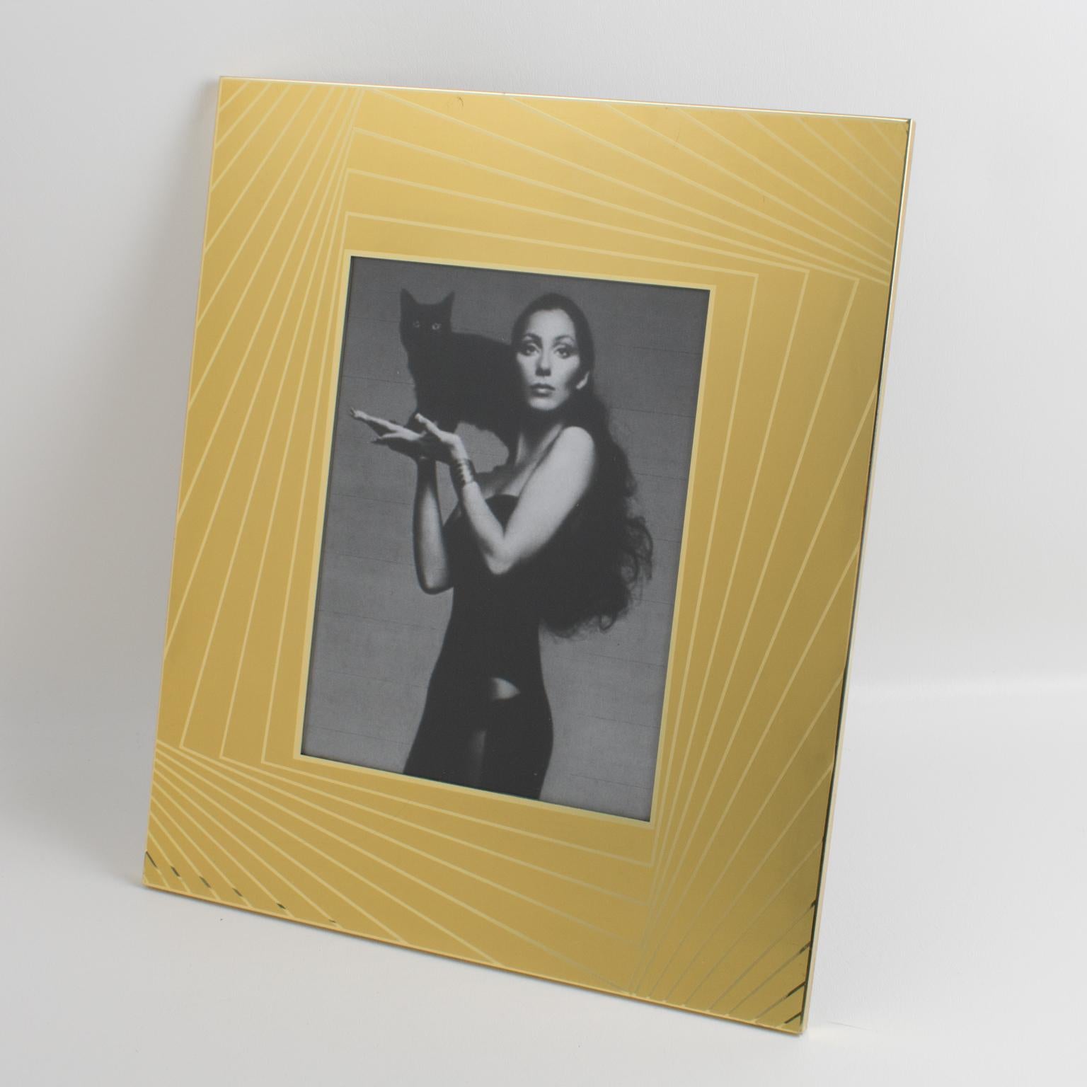 Mesmerizing 1970s picture photo frame, designed by Italian designer Umberto Mascagni in Bologna. Gilded aluminum with a shiny and frosted pattern. Metal easel at the back. Marked on the easel: 