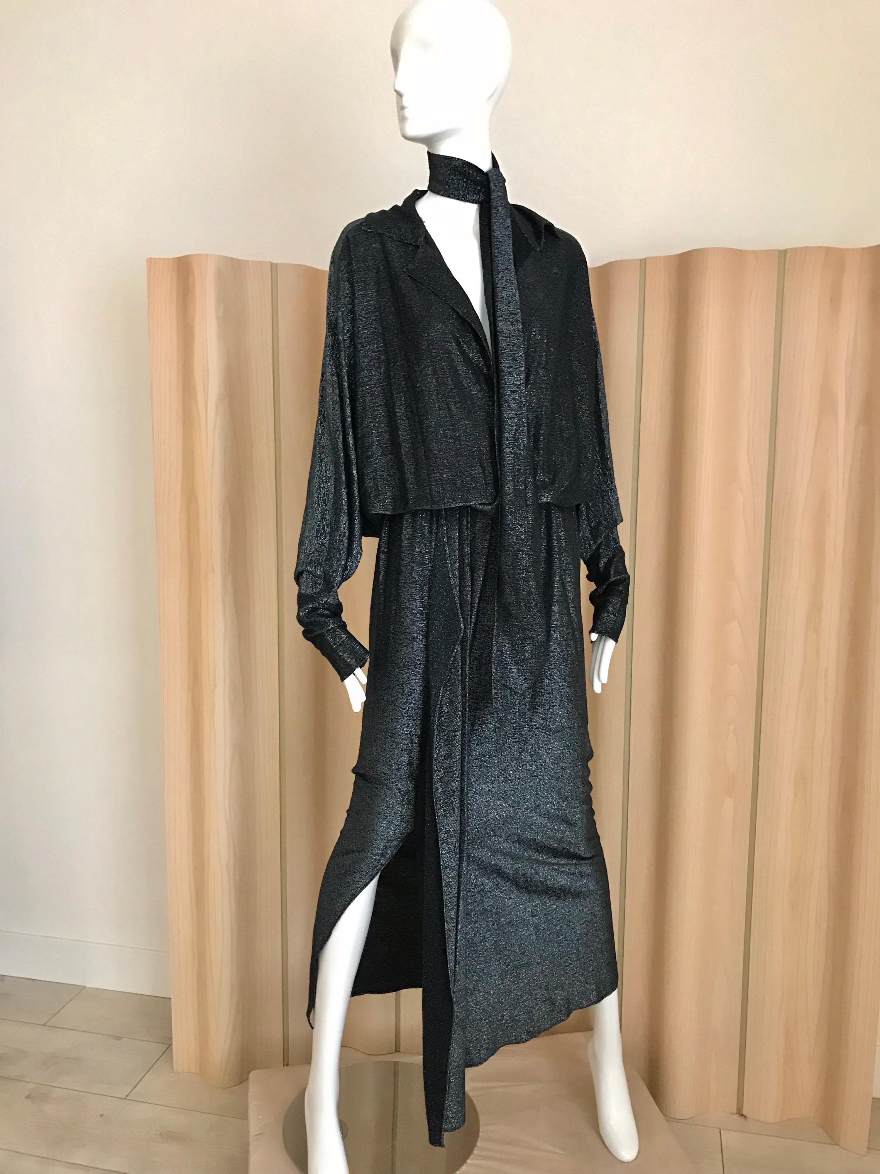 Vintage 1970s Giorgio Di Sant Angelo Black or more gun metal Soft jersey dress with metallic sheen. Batwing sleeves and with elastic waist. Dress can be worn V neck or high neck.  Perfect for Studio 54 party.
Size: 4-6-8