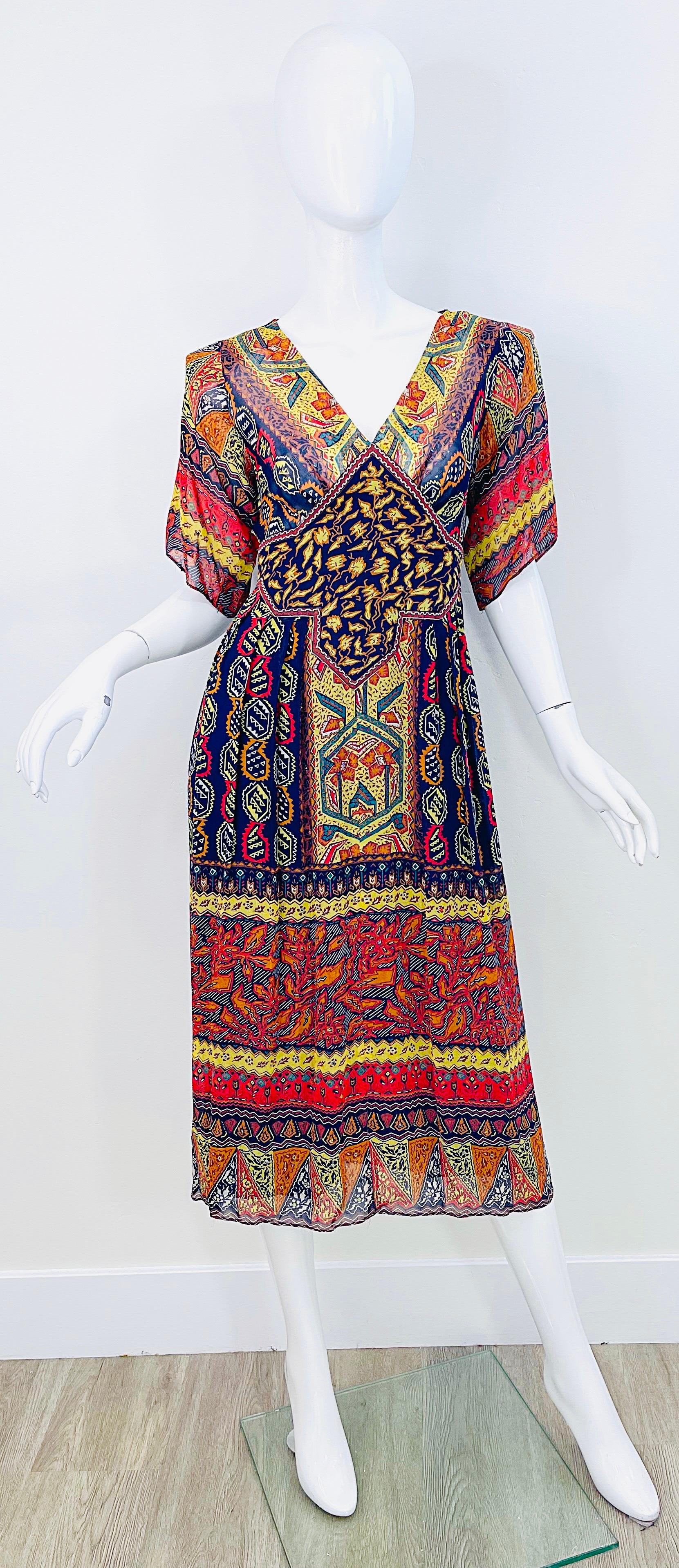Museum worthy 1970s GIORGIO SANT ANGELO boho chic silk chiffon rhinestone encrusted dress ! Features warm tones of navy blue, rust, marigold yellow, red, and green throughout. Multiple colored rhinestones encrusted all over. Hidden zipper up the