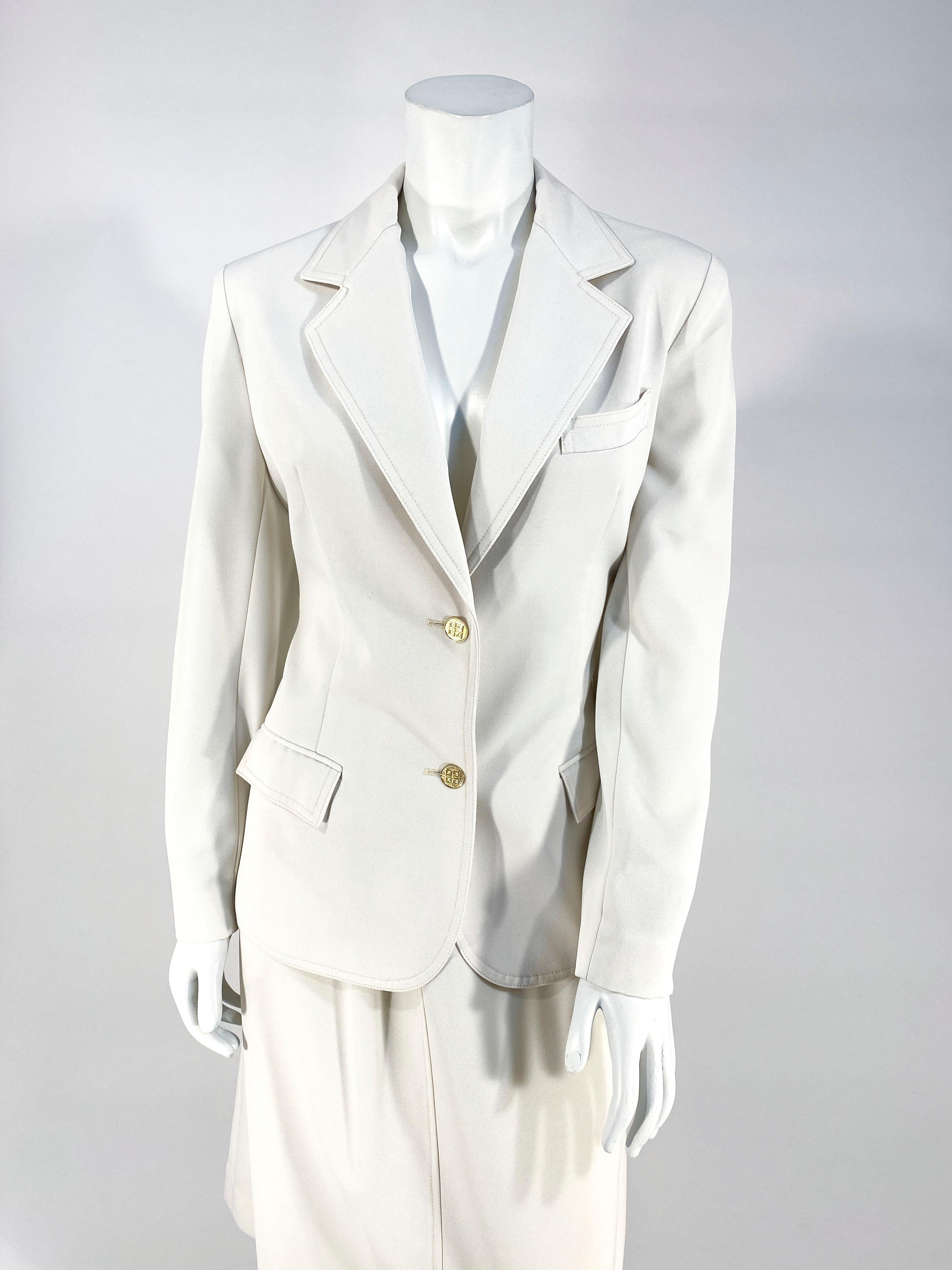 1970s Givenchy cream-colored polyester sports suit with brass buttons with the Givenchy Logo.