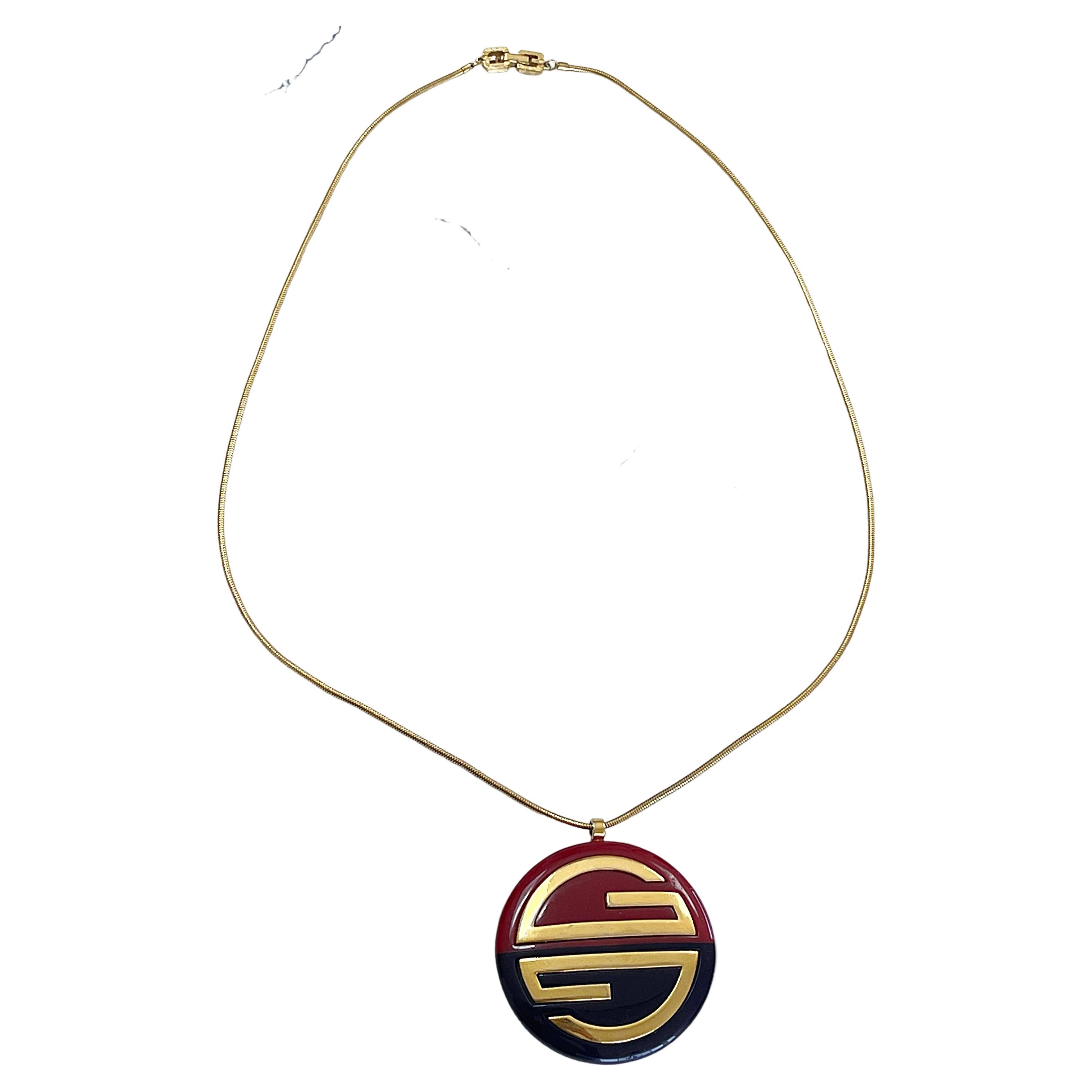 1970s GIVENCHY Navy Amber Gold Plated 1977 Large Statement Logo Vintage Necklace For Sale