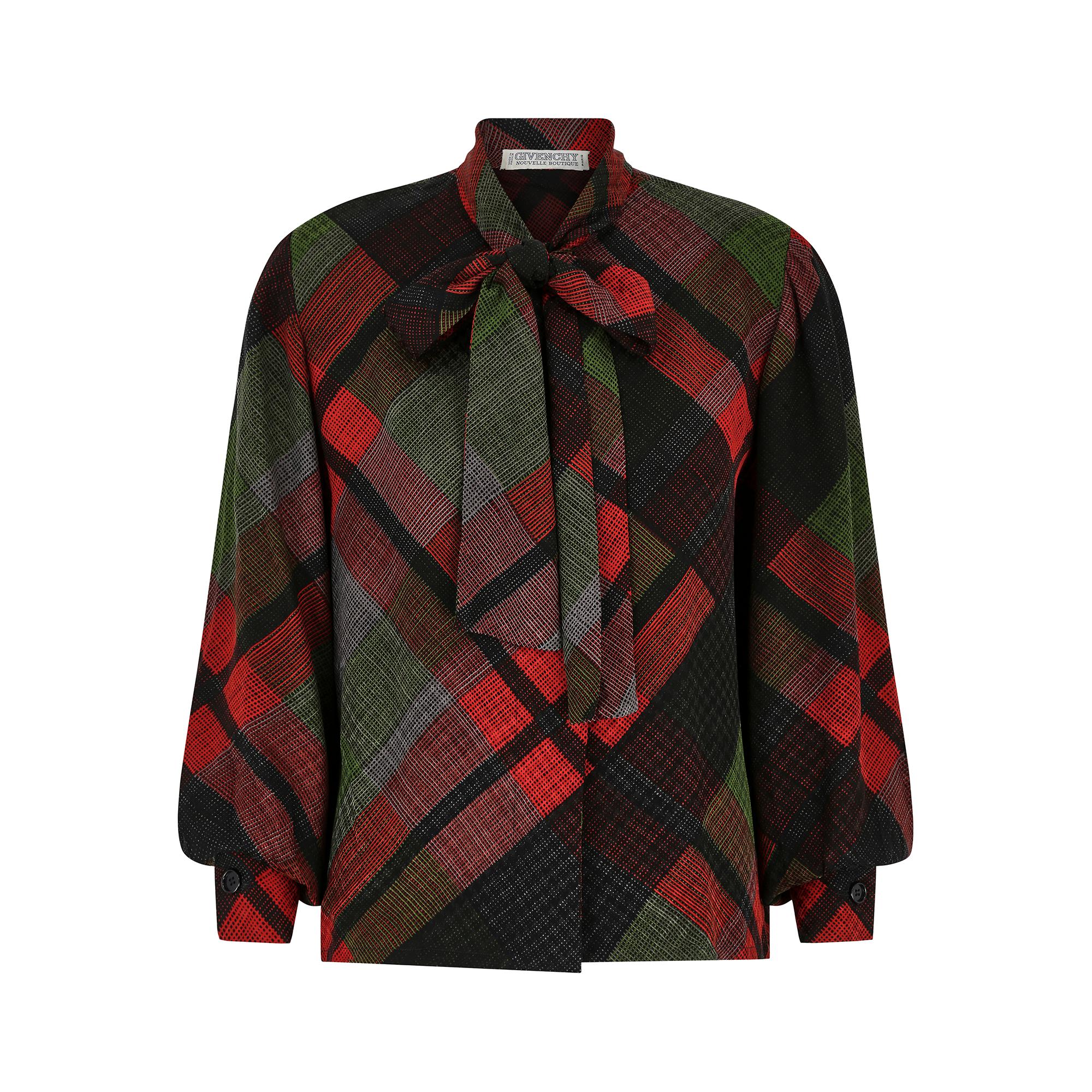 Early 1980s or very late 1970s Givenchy Novelle Boutique pussy bow blouse from the designer’s ready-to-wear collection first debuted 1954 with this line produced from 1971. The fine quality silk fabric features a chic red, black and green plaid that