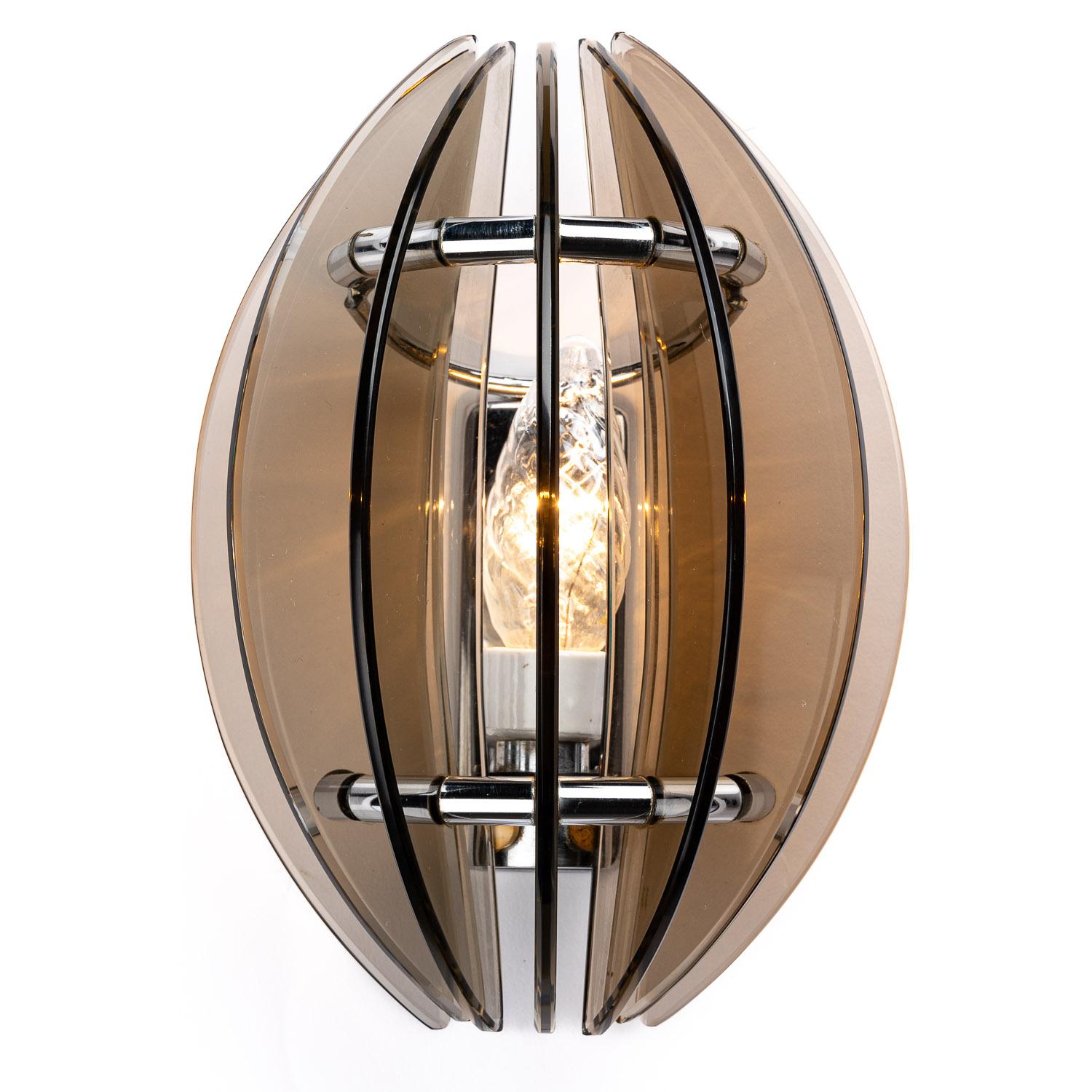 This is a stand-out piece from the designer Veca in Italy. At the cutting-edge of 1970s design, this set of lighting is bold and beautiful. Bladed glass wedges brown in colour, surrounding a single E14 bulb. 

We have four pieces in total. This is