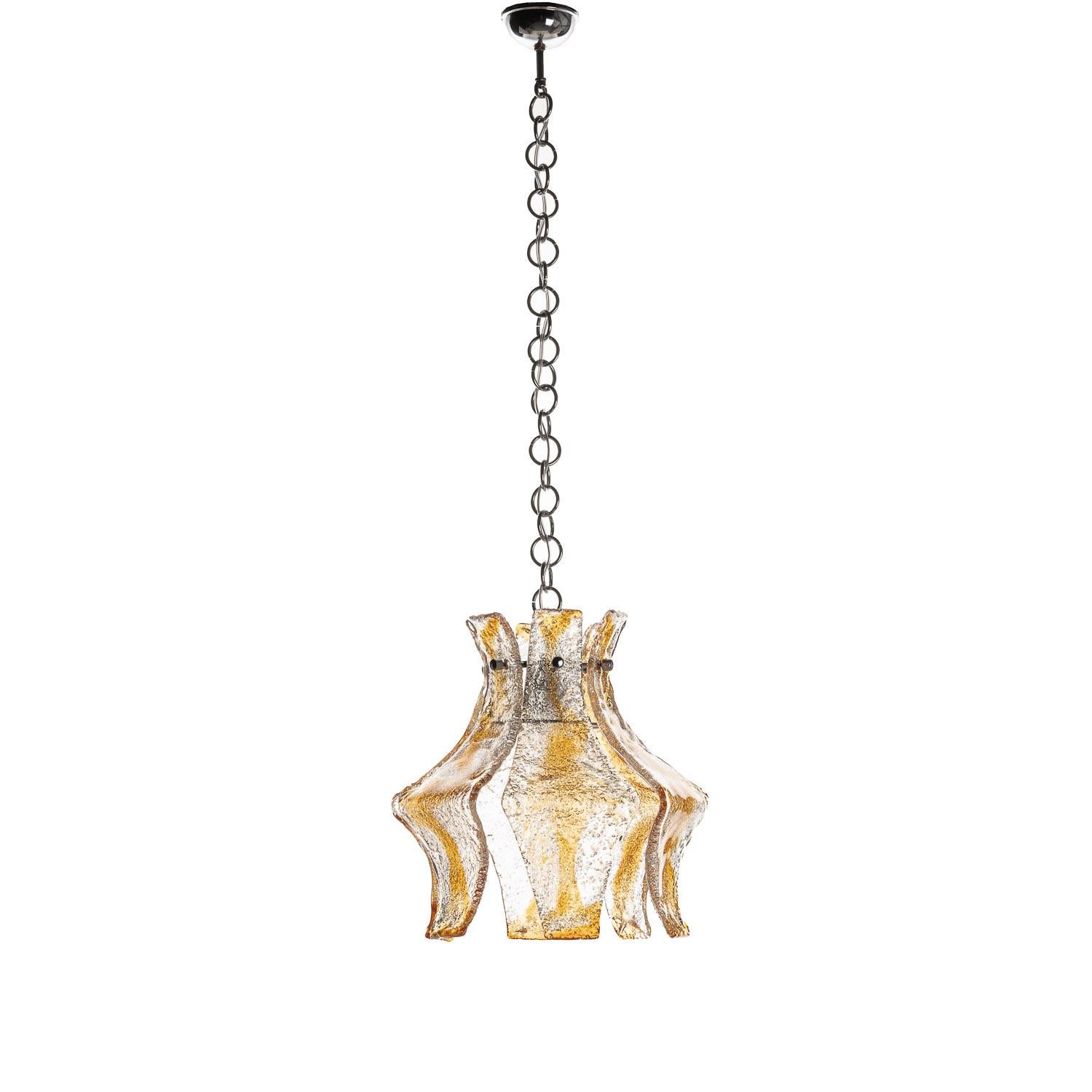 This rare piece comes from designer Carlo Nason (manufactured by Mazzega in Italy). The textured pieces surrounding the bulb are incredibly unique and elegant in their flowing curvature, blending tones of copper into the glass. When illuminated,