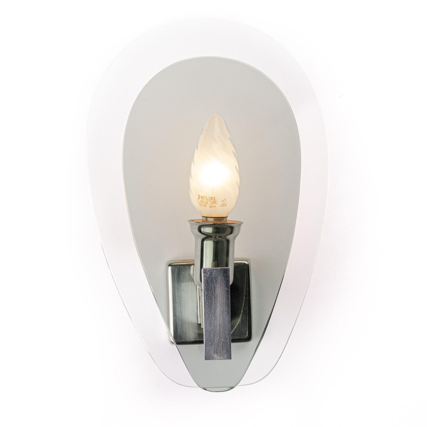 This is an elegant set of wall lights from the designer Veca in Italy has two glass plates with the smaller plate grey colored and larger plate is clear glass, in front of a single E14 bulb in a chrome frame.