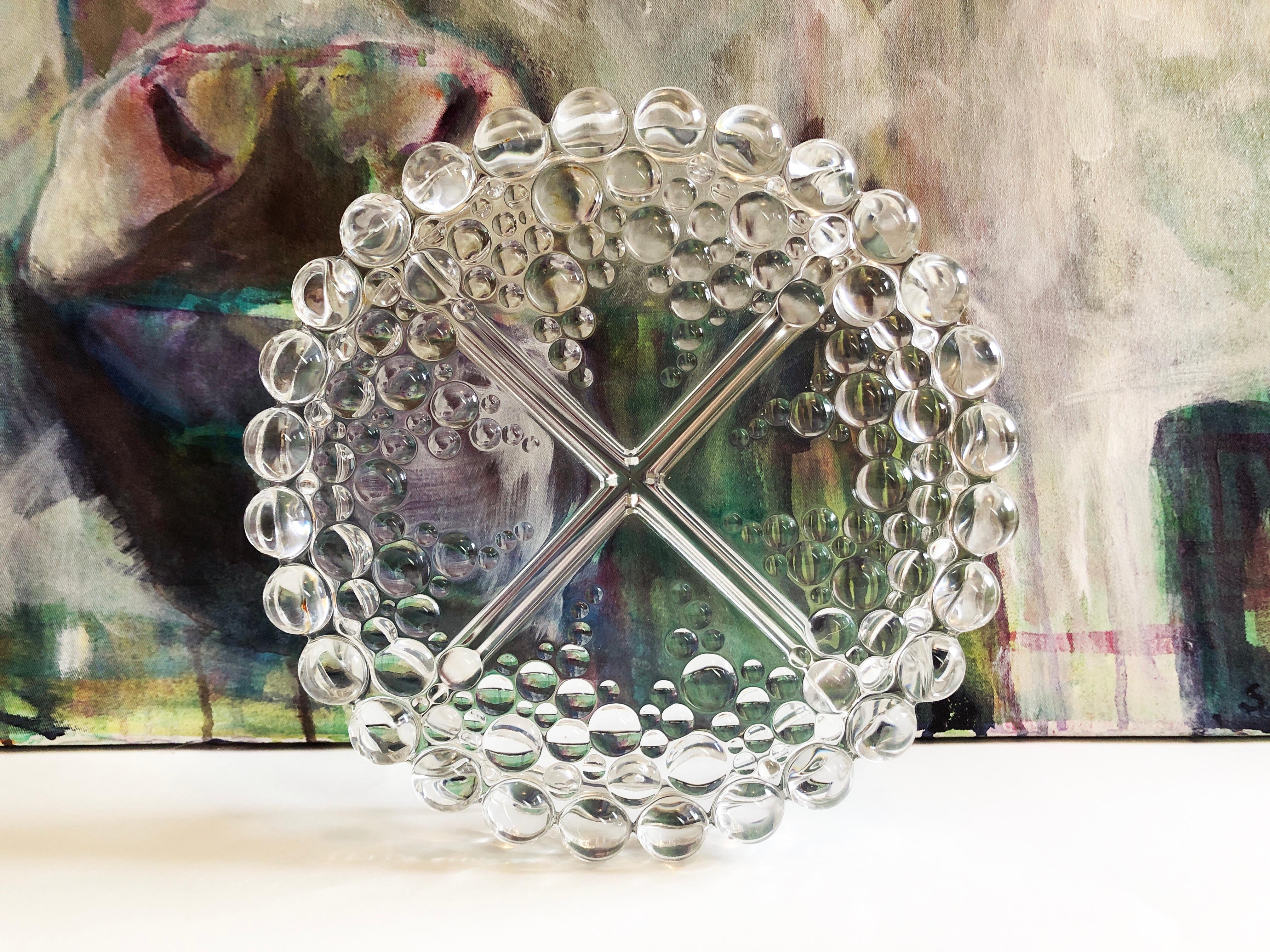 A true star of 70s design is this glass snack bowl from the ''Bolero Bubble'’ collection by Walther Glas.
Round “snack