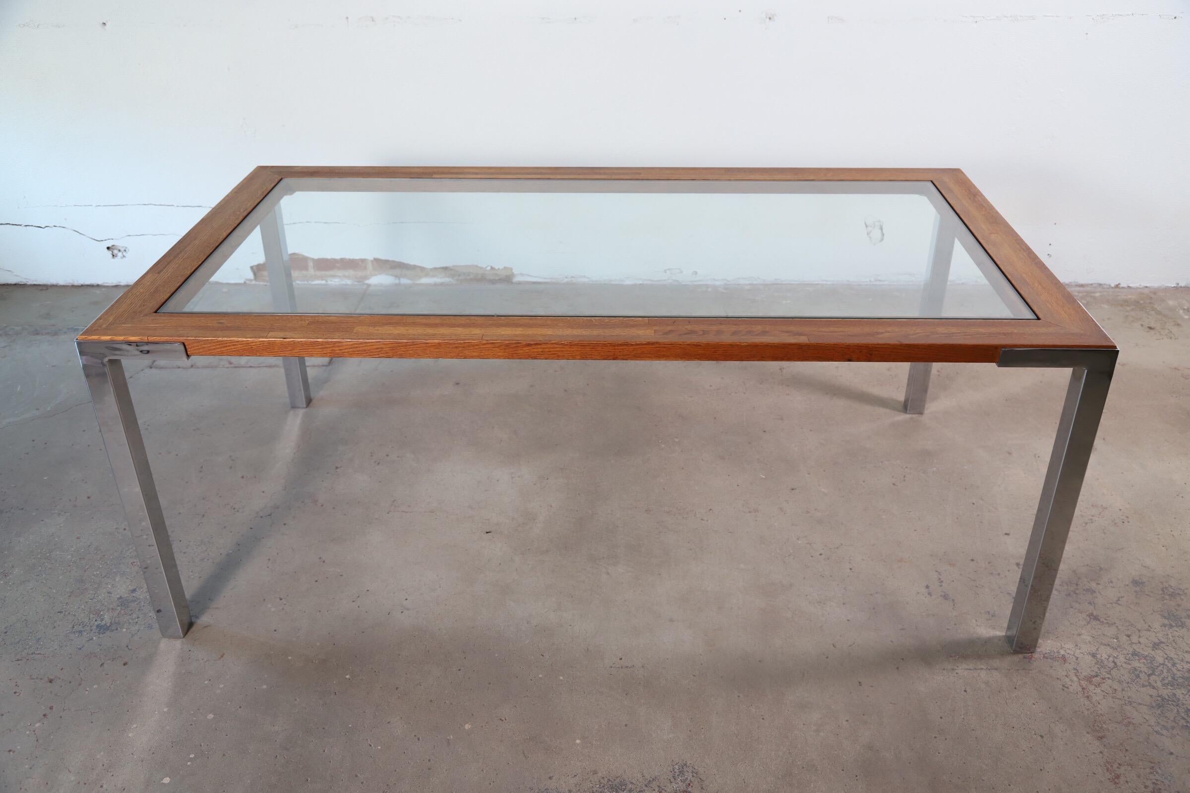 Wonderfully simplistic parsons style 1970s rectangular dining table. Made of glass, wood and chromed steel legs. 

Would make for an amazing executive desk or conference table.