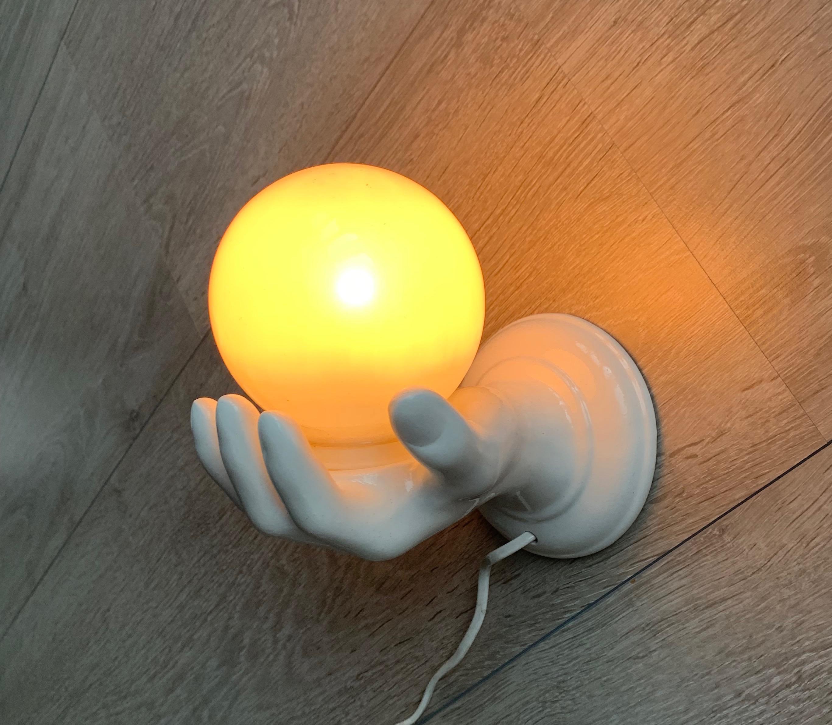 Good quality and fine condition, left hand sculpture wall light.

If you are looking for an out of the ordinary wall light then this rare specimen could be just perfect for you. This midcentury sculptural ceramic wall light could be ideal for a