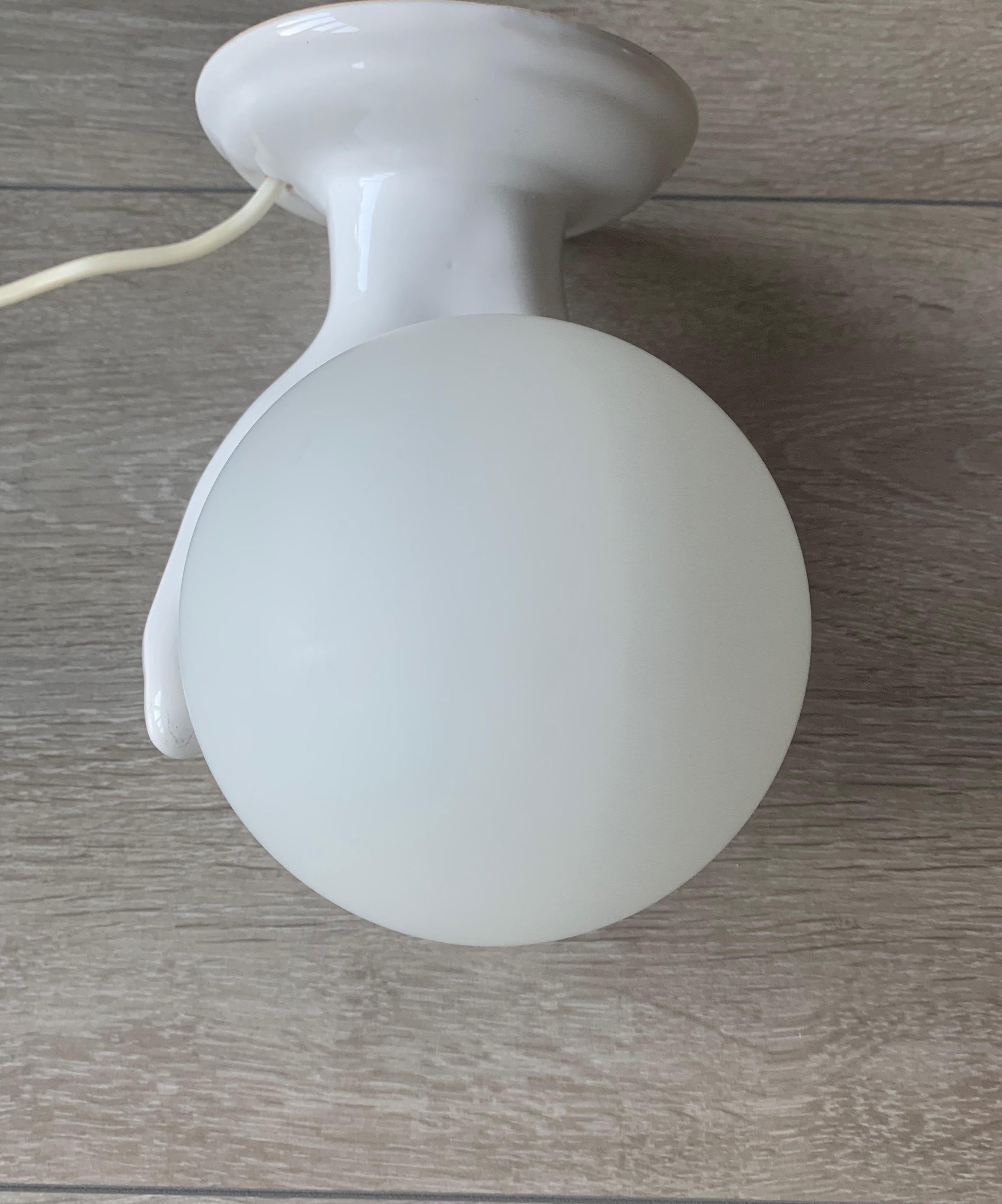 1970s Glazed White Ceramic Hand Holding a Glass Globe Wall Sconce or Wall Light In Good Condition In Lisse, NL