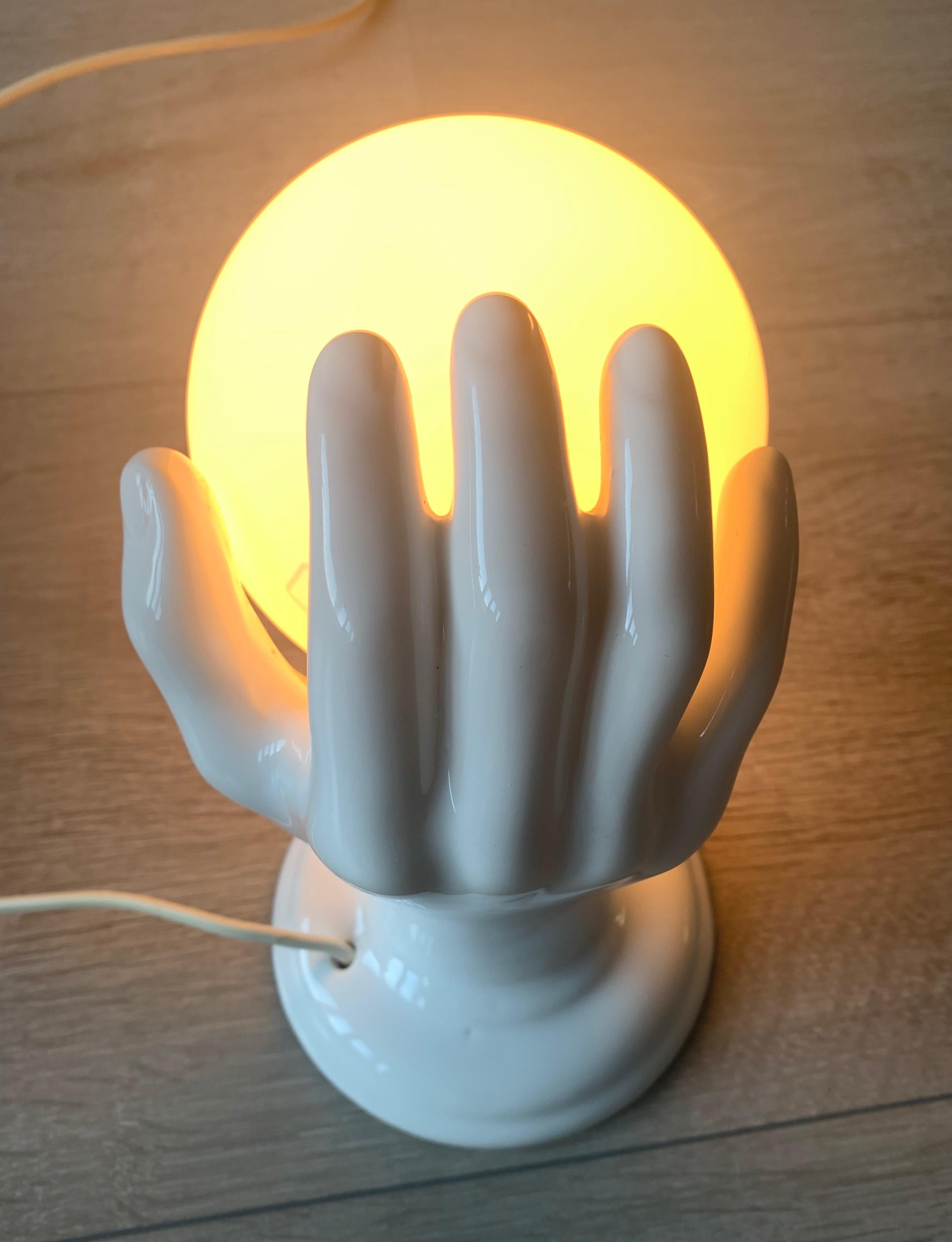 20th Century 1970s Glazed White Ceramic Hand Holding a Glass Globe Wall Sconce or Wall Light