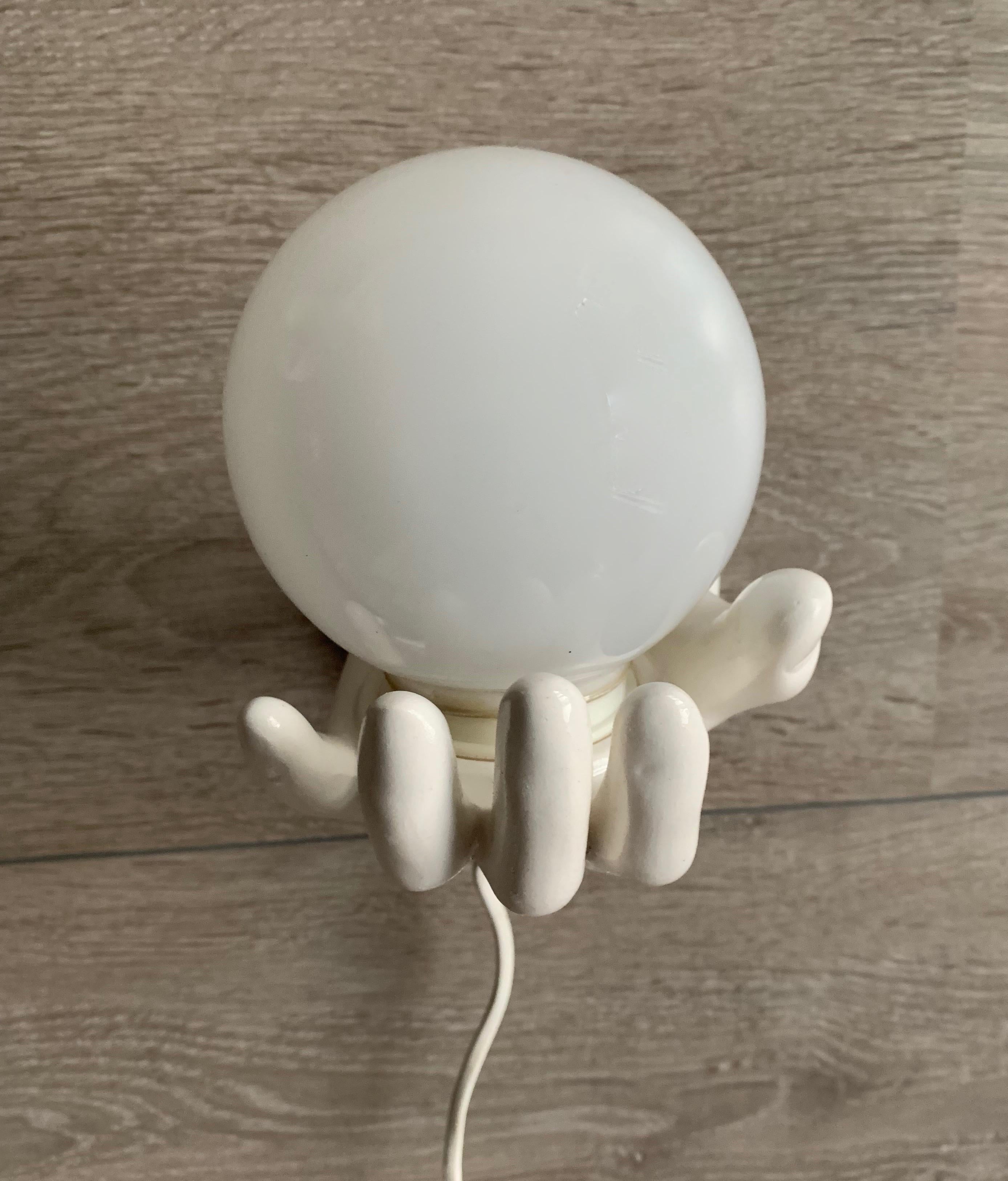 1970s Glazed White Ceramic Hand Holding a Glass Globe Wall Sconce or Wall Light In Good Condition In Lisse, NL