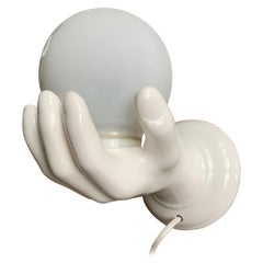 1970s Glazed White Ceramic Hand Holding a Glass Globe Wall Sconce or Wall Light