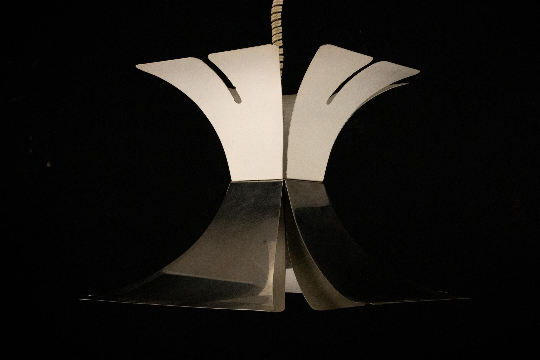 Iconic chandelier from the 1970s, in lacquered metal and chrome, attributed to Italian designer Goffredo Reggiani. Features a unique, sculptural design with fan-shaped elements—perfect for vintage or modern interiors. In excellent vintage condition,