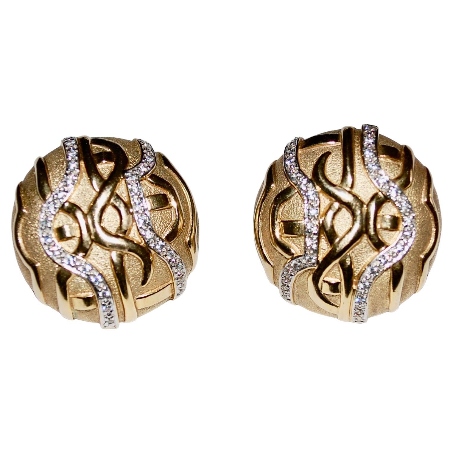 Vintage stunning clip on earrings, gold marked JC 9K Gold CZ, for Cubic Zirconia. 
Of circular outline in polished and textured gold, enhanced by undulating lines of circular-cut cubic zirconia. About 1 inch round weight about 23.3 grams.