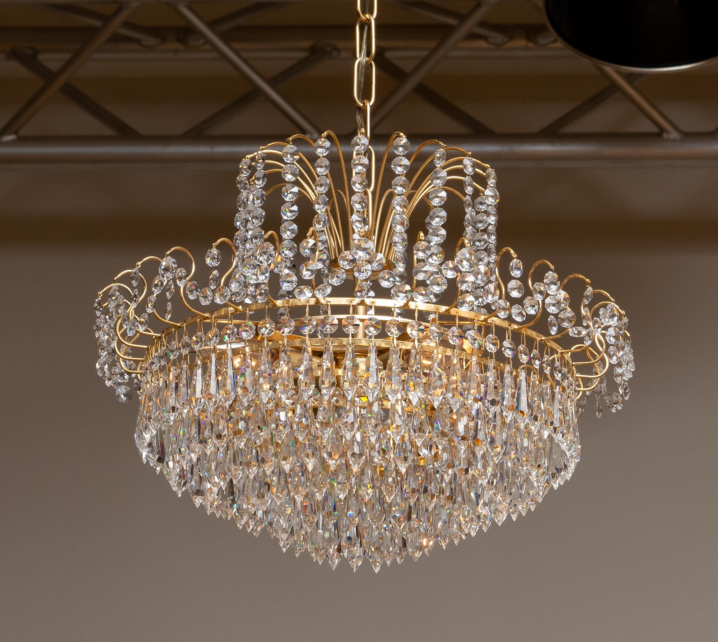 Neoclassical Revival 1970s, Gold-Plated and Faceted Crystal Chandelier Attributed to Reijmyre, Sweden For Sale