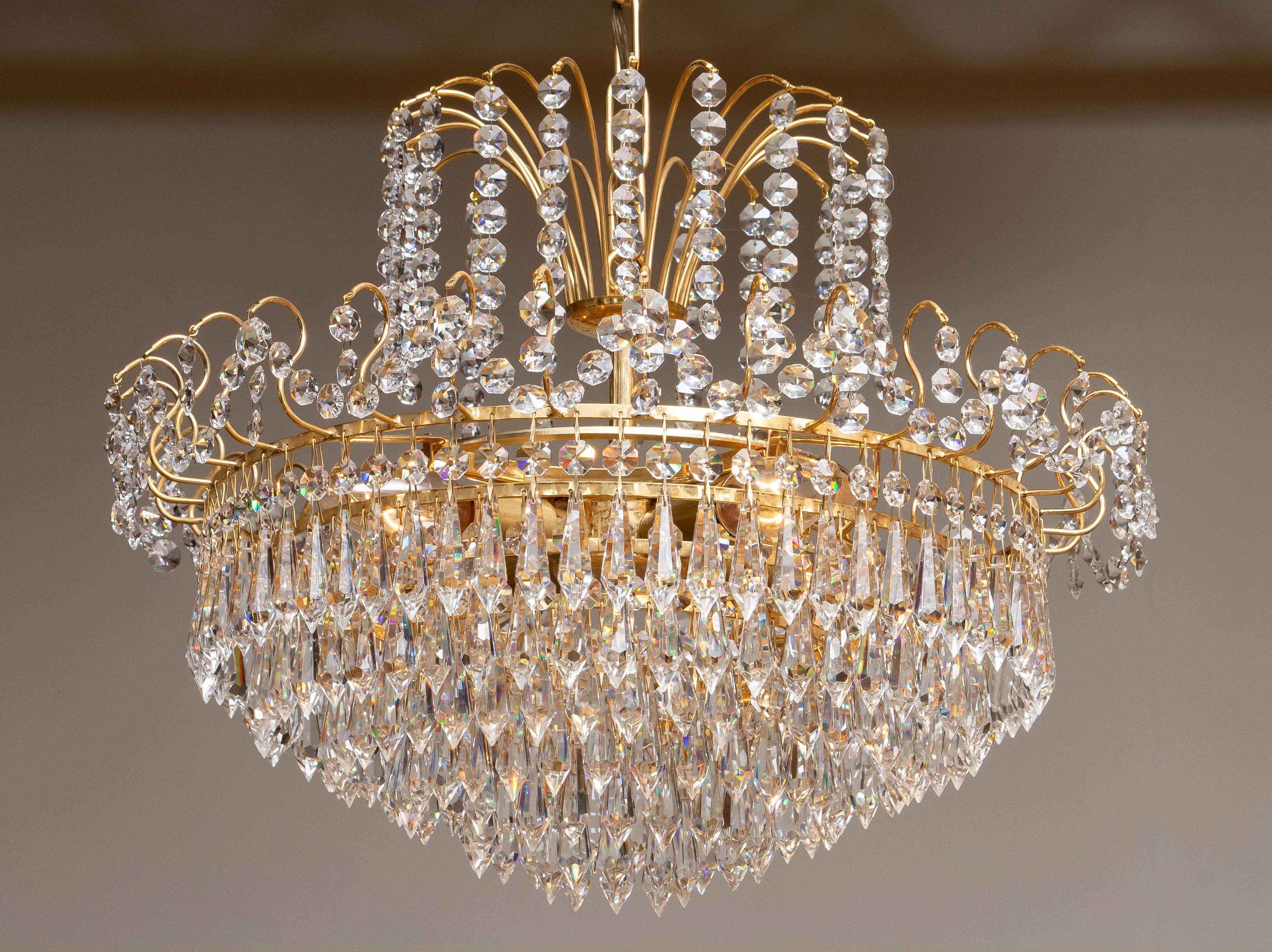 Late 20th Century 1970s, Gold-Plated and Faceted Crystal Chandelier Attributed to Rejmyre Sweden