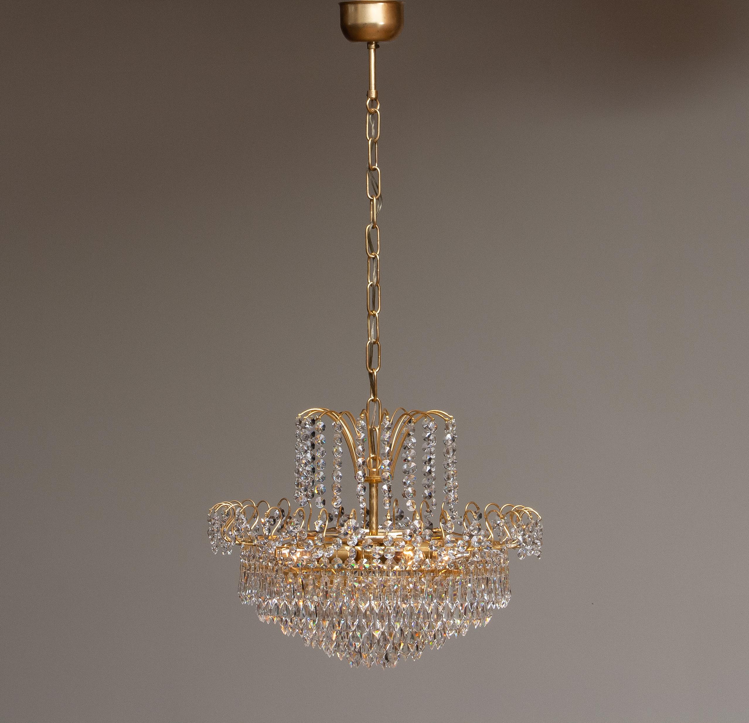 1970s, Gold-Plated and Faceted Crystal Chandelier Attributed to Rejmyre Sweden 1