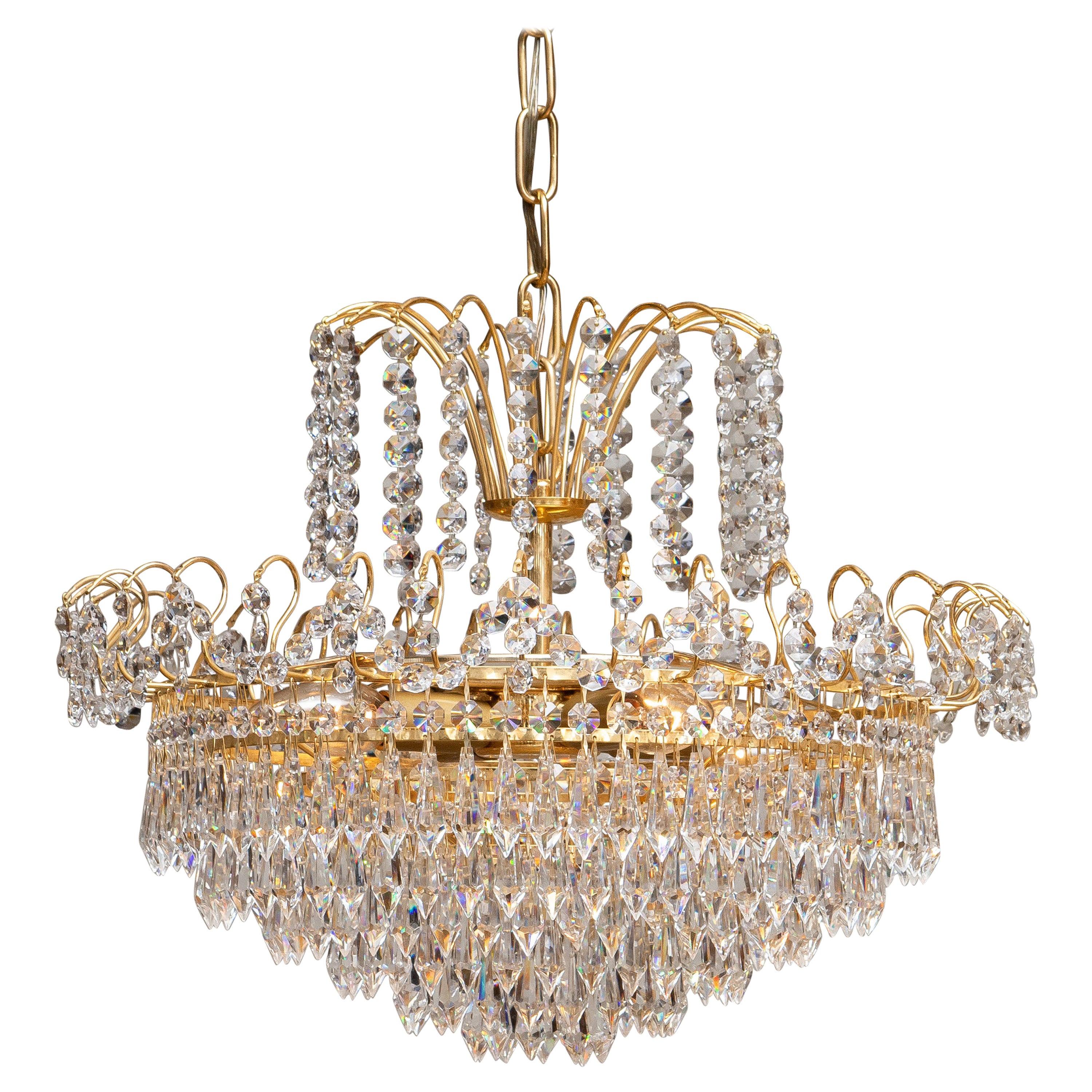 1970s, Gold-Plated and Faceted Crystal Chandelier Attributed to Rejmyre Sweden