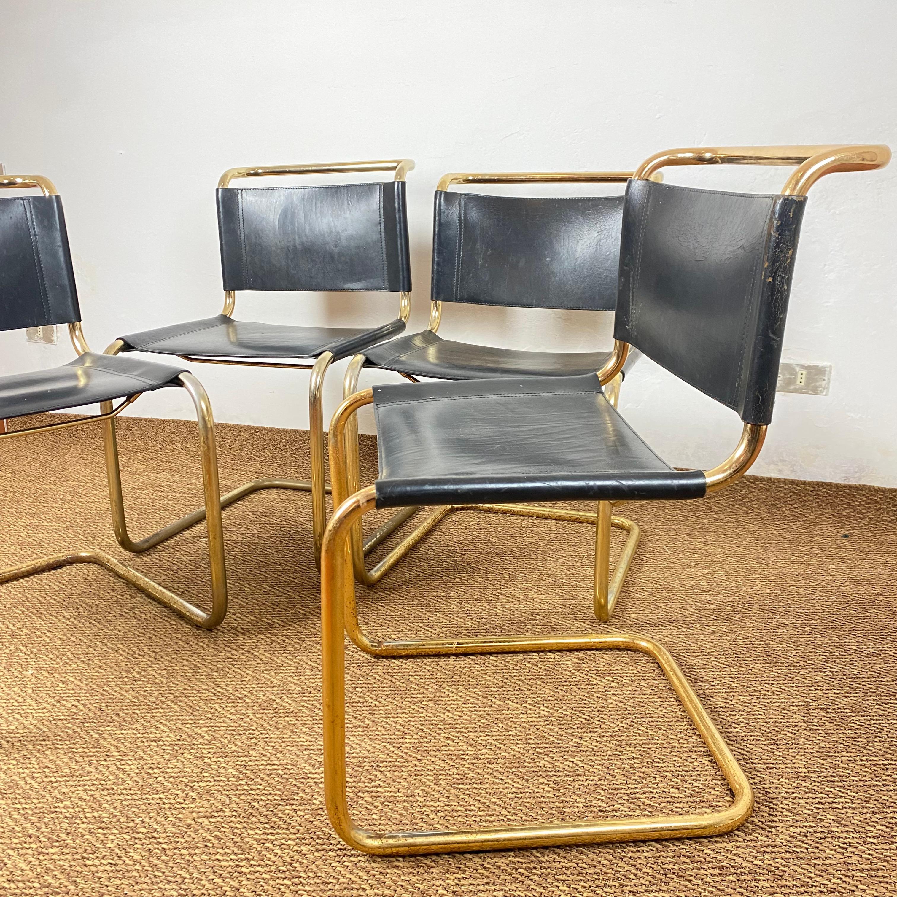 Superb set of 4 cantilever chairs produced by the Steeline company. The chairs are inspired by Mart Stam's iconic SS33 model.
 
 The chairs are in thick black leather with signs of the time but in perfect structural condition, the tubular is in