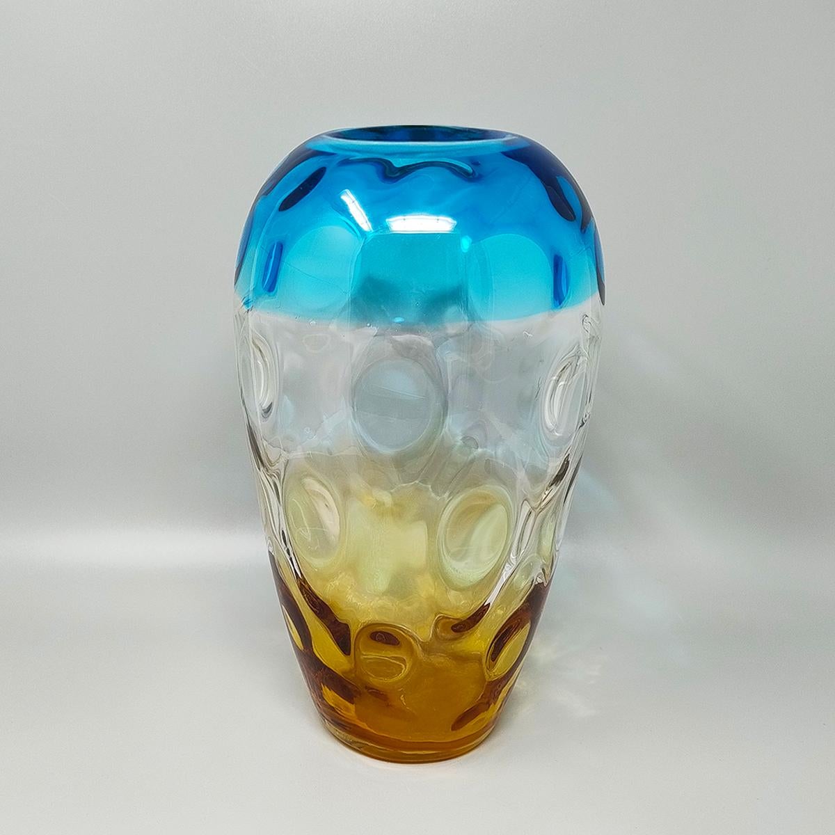 1970s Gorgeous blue and amber vase by Ca dei Vetrai in Murano glass. Made in Italy. The item is in excellent condition. 
Dimension:
diameter 6,29 x 11,81 H inches
diameter cm 16 x cm 30 H