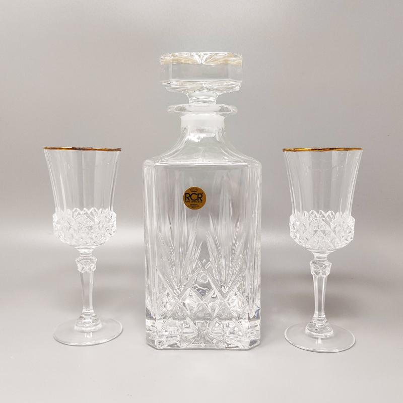 1970s Gorgeous crystal decanter by RCR with 2 crystal glasses. Made In Italy The items are in excellent condition. 
Dimension:
Decanter
diam 3,93