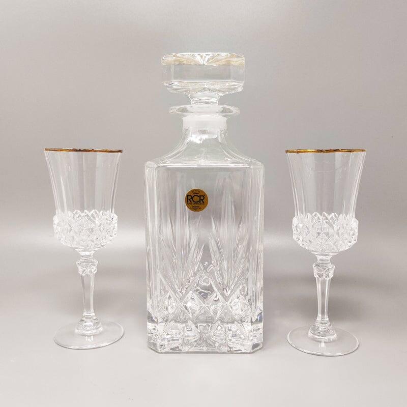 Años 70 Precioso decantador de cristal de RCR con 2 vasos de cristal. Made In Italy Los artículos están en excelentes condiciones. 
Dimensión:
Decantador
diam 3,93