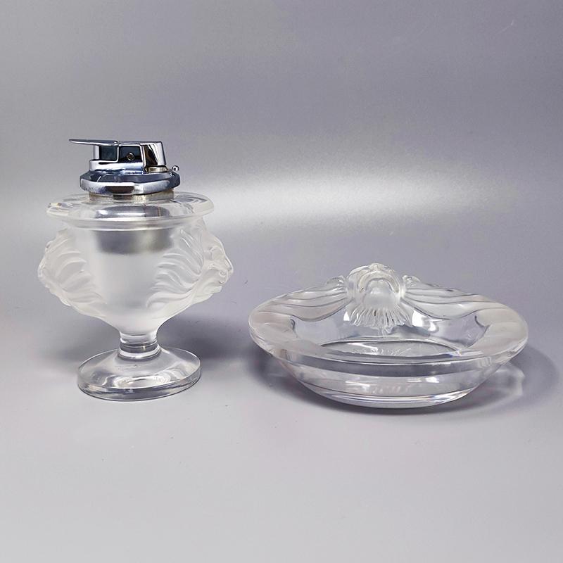 1970s Gorgeous smoking set in crystal by Lalique. made in France. The both pieces are signed on the bottom. Made in France. The table lighter works perfectly.
The items are in excellent condition. This set is a true piece of art, not easy to find
