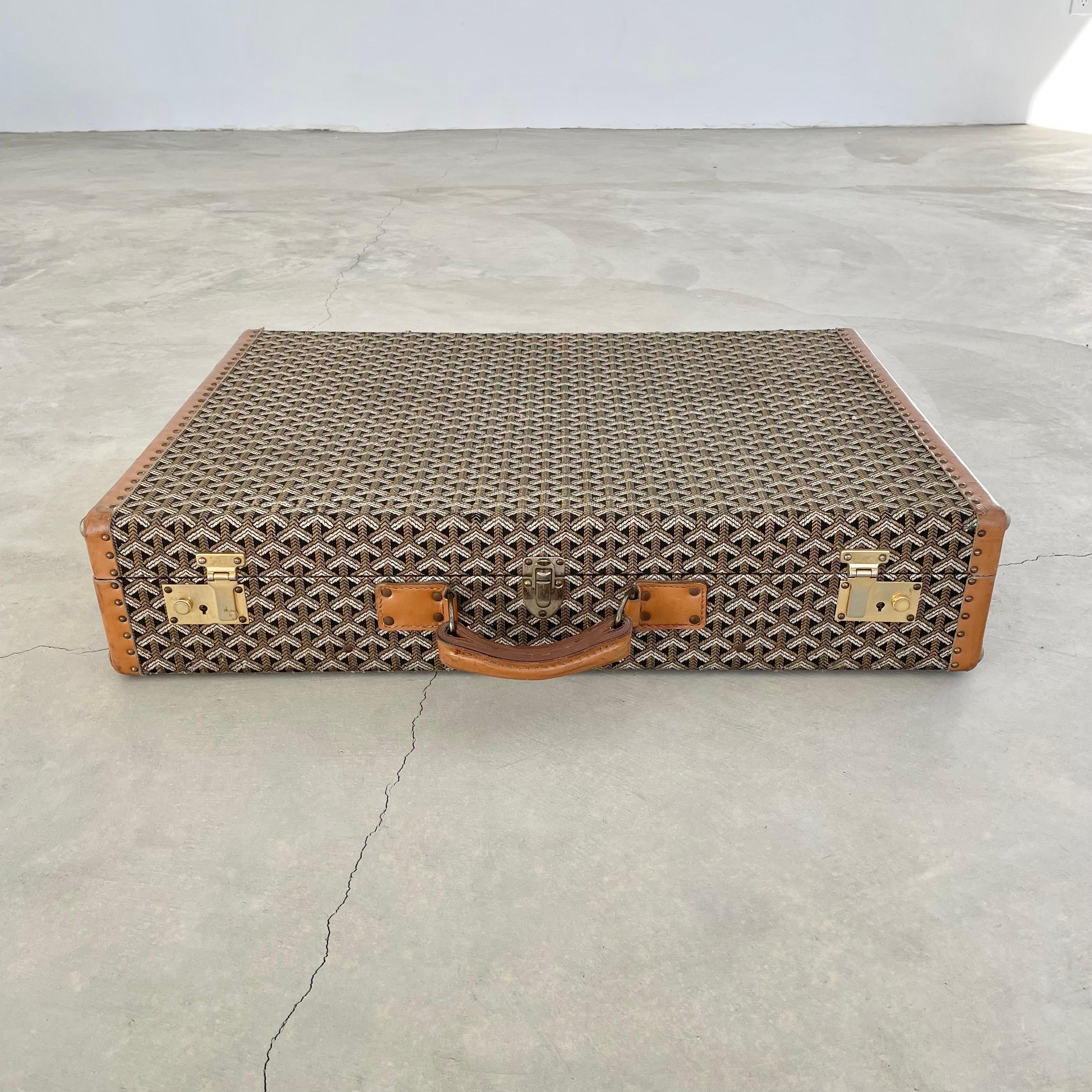Classic vintage Goyard trunk with (Jacquard canvas) woven cotton canvas. Iconic Goyard print with saddle leather and brass hardware. Timeless simplicity in design and iconic badging have made this brand a staple of elegance since 1853. Initially