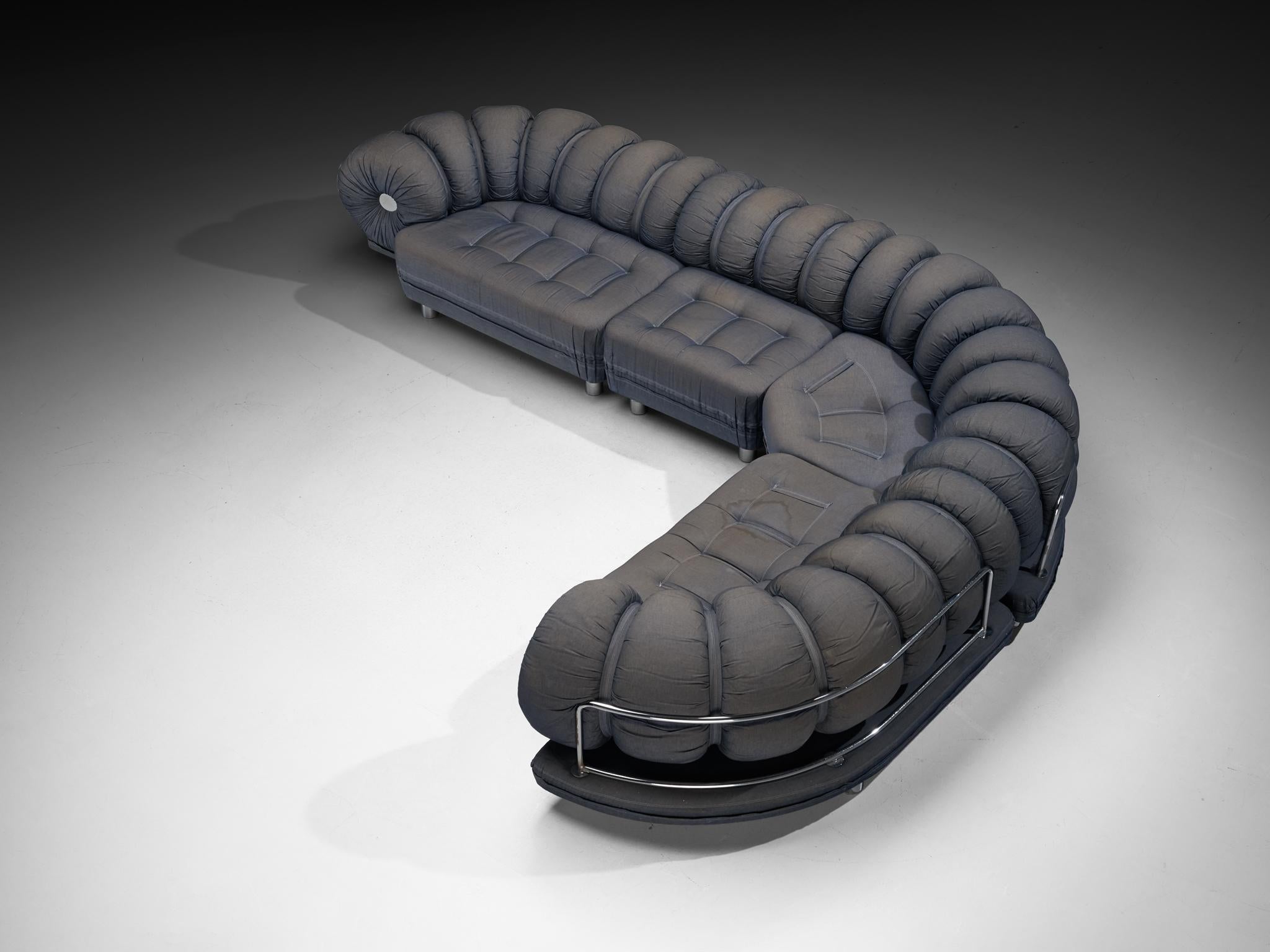 Curved modular sofa, fabric, chrome-plated steel, Italy, 1970s

This Italian sofa from the 1970s takes on a distinctly biomorphic form, with an unmistakable visual reference to a caterpillar. Its segmented backrest, composed of plump, tubular