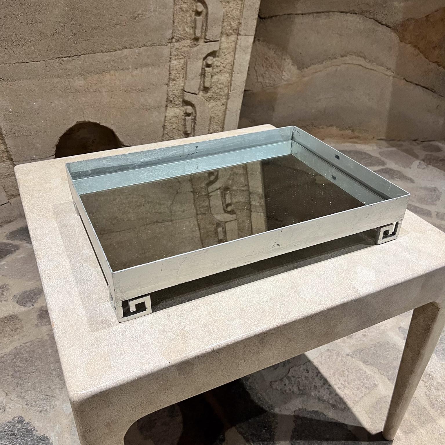 AMBIANIC presents
Greek Motif Service Tray Art Deco Style
3.5 h x 30 long x 14 d
Metal with silver lead finish.
New mirror top
unmarked
Preowned vintage, refer to images provided