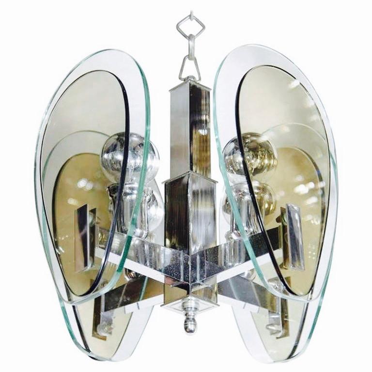 Italian Mid-Century Modern architectural pendant light with four sided chrome frame. Comprised of dual teardrop glass shades in hues of smoked gray and green. The chandelier has original diamond link chain with stylized chromed fittings. Great scale