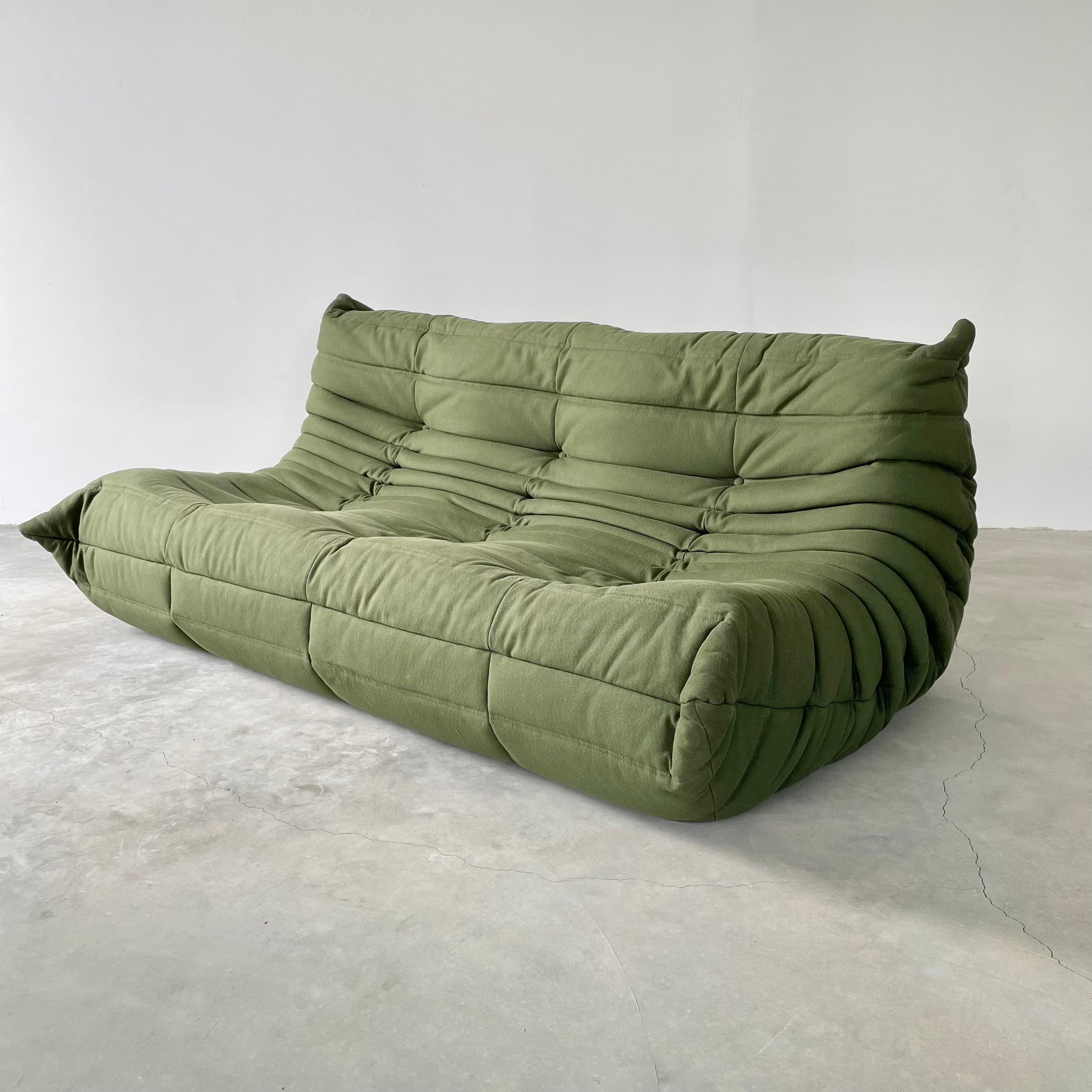 Classic French Togo sofa by Michel Ducaroy for luxury brand Ligne Roset. Originally designed in the 1970s the iconic togo sofa is now a design classic. This sofa comes in its original, hardly used, green canvas fabric

Timeless comfort and style