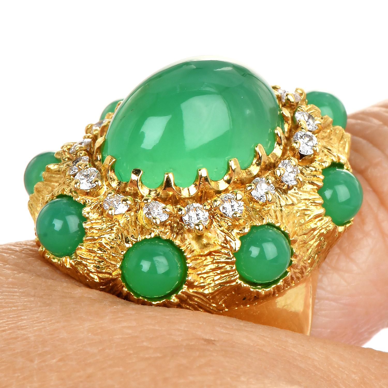 An outstanding luxurious cocktail ring with hand-carved accents. 

Crafted in solid 18K Yellow Gold

Centered by a cabochon Green Chalcedony, Oval cut, prong set, measuring 13 mm x 10 mm, weighing  4.70 carats

Sided with (8) cabochon Green