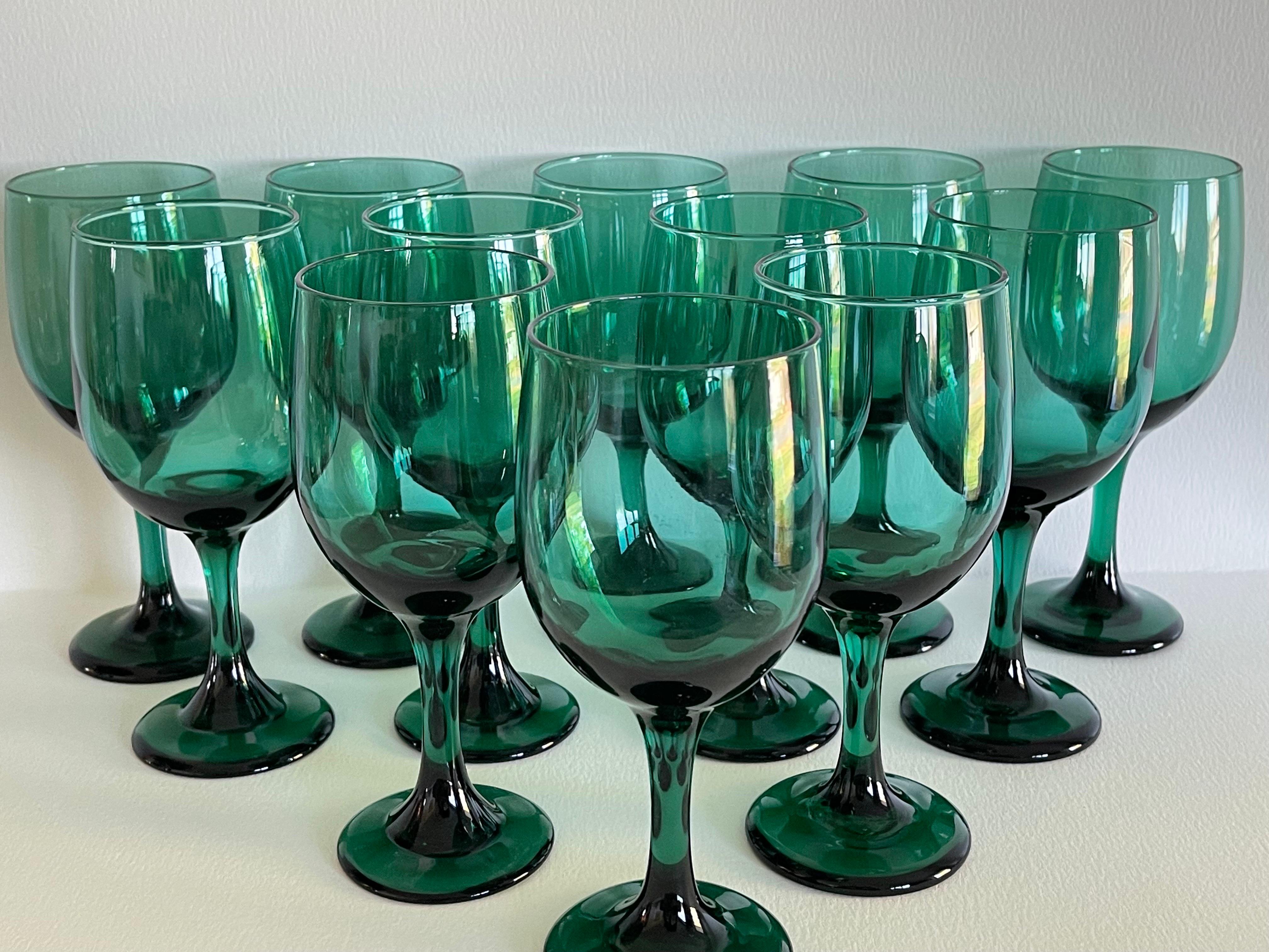 Vintage 1970s set of twelve green glass wine stems. No marks.