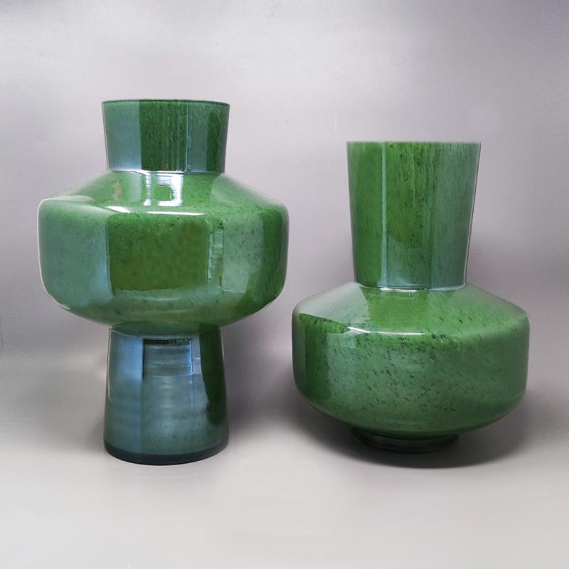 1970s Gorgeous green pair of vases in Murano glass by Dogi. These vases are two sculptures and they are in excellent conditions. Made in Italy.
Measures: diameter 9,05
