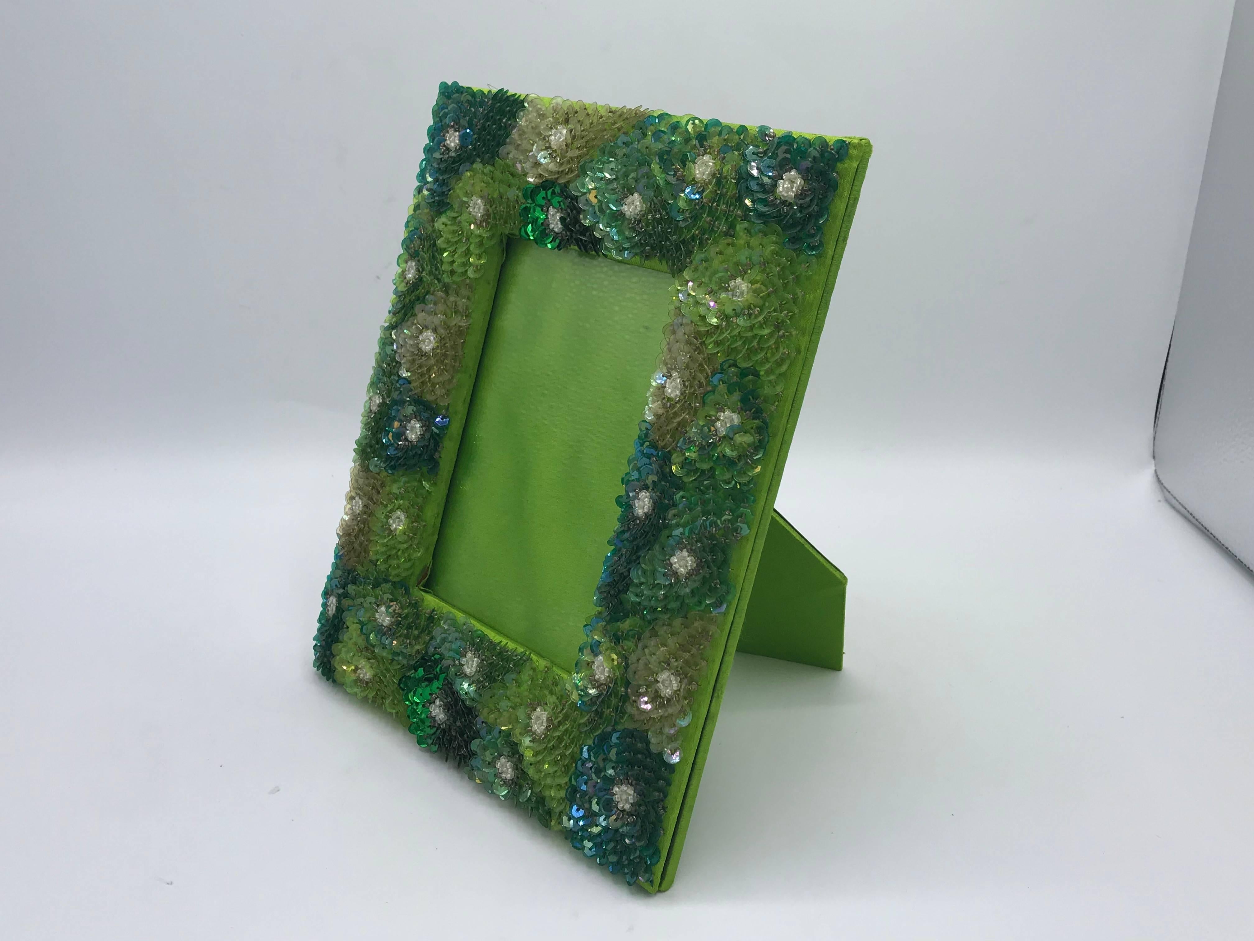 Listed is a glamorous, 1970s modern green sequin embroidered picture frame. Fits a standard 4