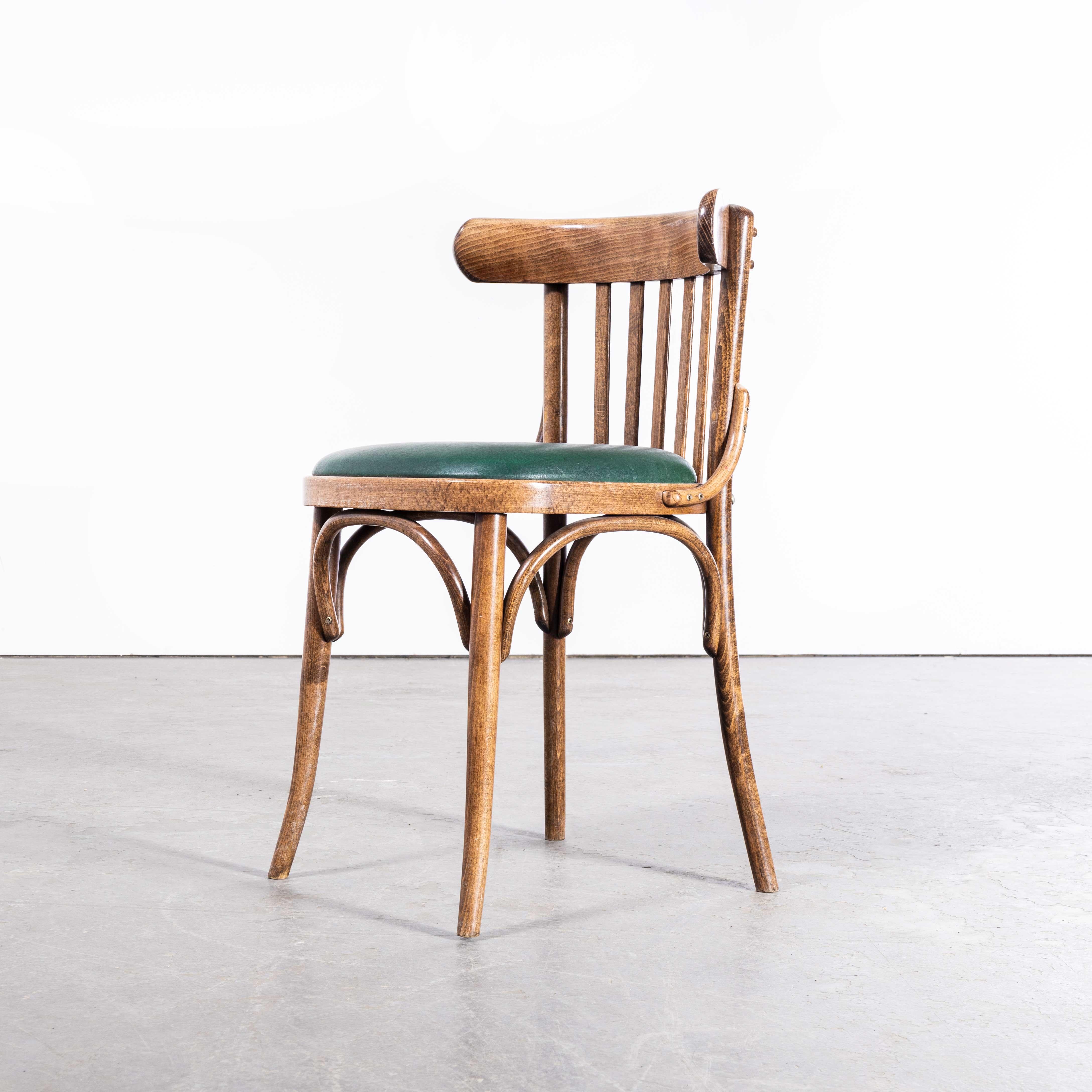 1970s Green Upholstered Bentwood Dining Chair – Set Of Thirteen
1970s Green Upholstered Bentwood Dining Chair – Set Of Thirteen. Good quality set of thirteen Classic bentwood chairs with a typical slatted saddle back design. The chairs were made in