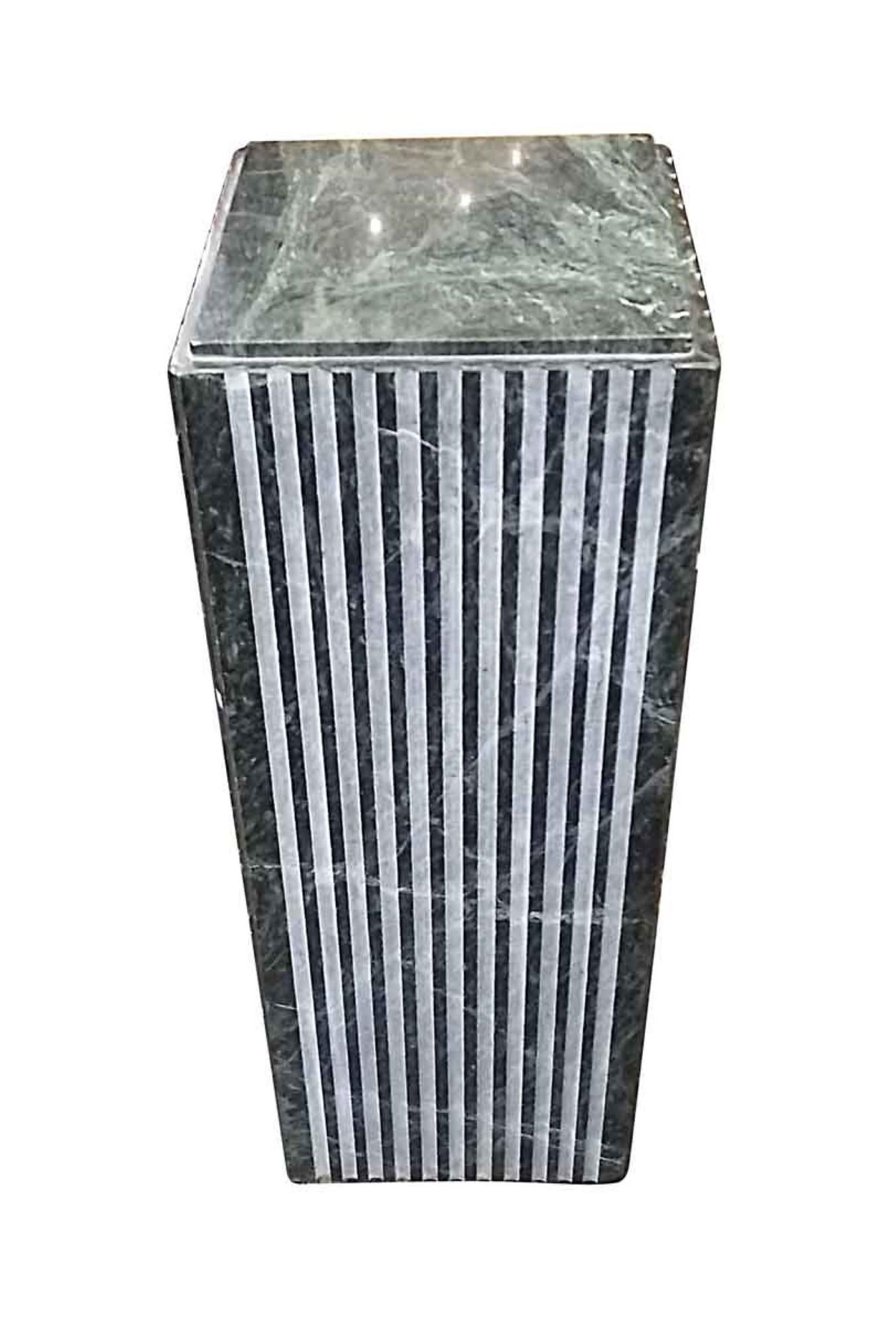 1970s Italian green and white veined marble pedestal with fluted sides. This can be seen at our 2420 Broadway location on the upper west side in Manhattan.