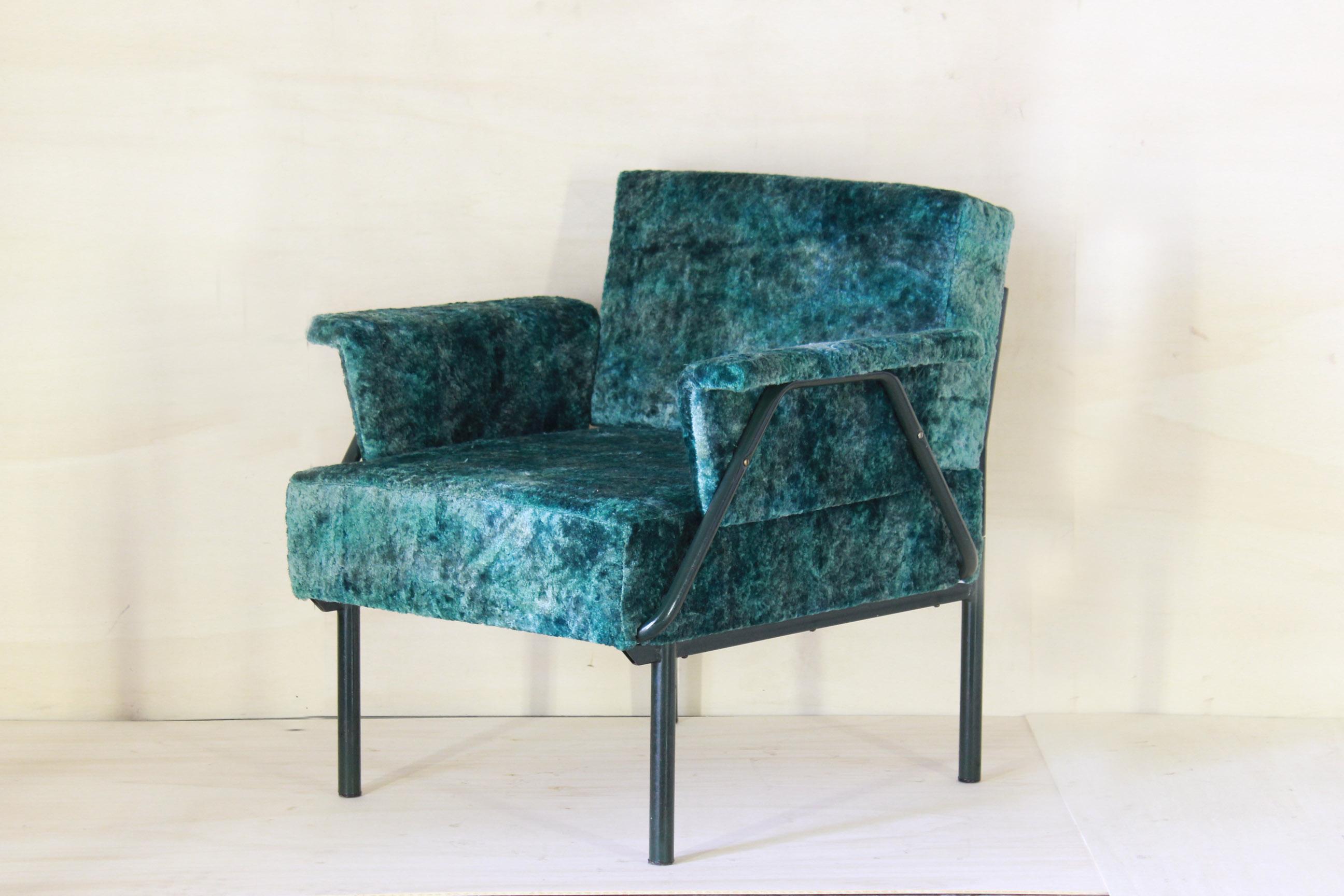 A 1970s vintage armchair with green fabric cover and iron structure. The filling and the fabric are brand new ones. In excellent conditions with only few signs of time of the tubular iron frame.