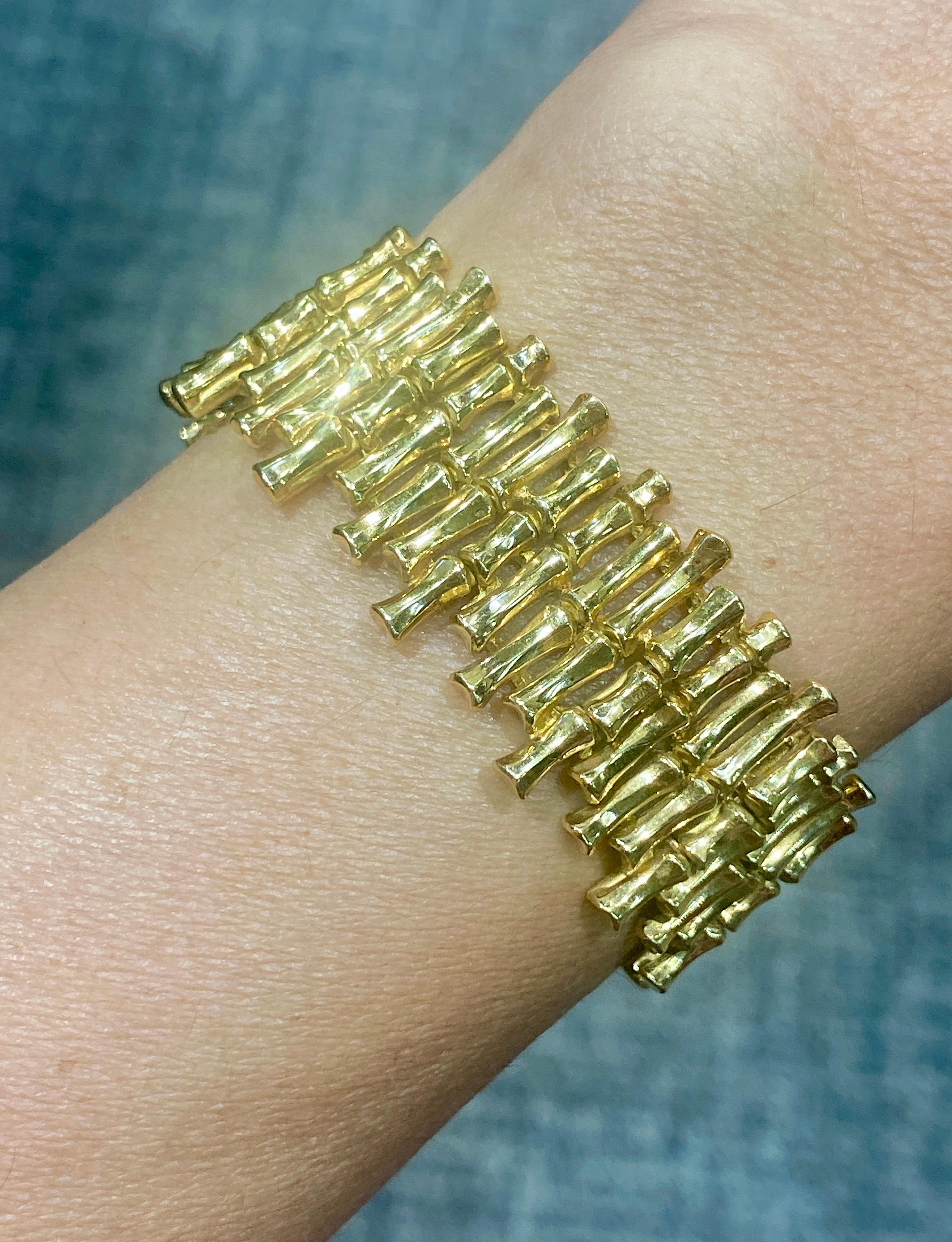 This is a beautifully made 1970's Gübelin 18k gold bracelet with a bamboo design. It is good weight and very comfortable to wear.