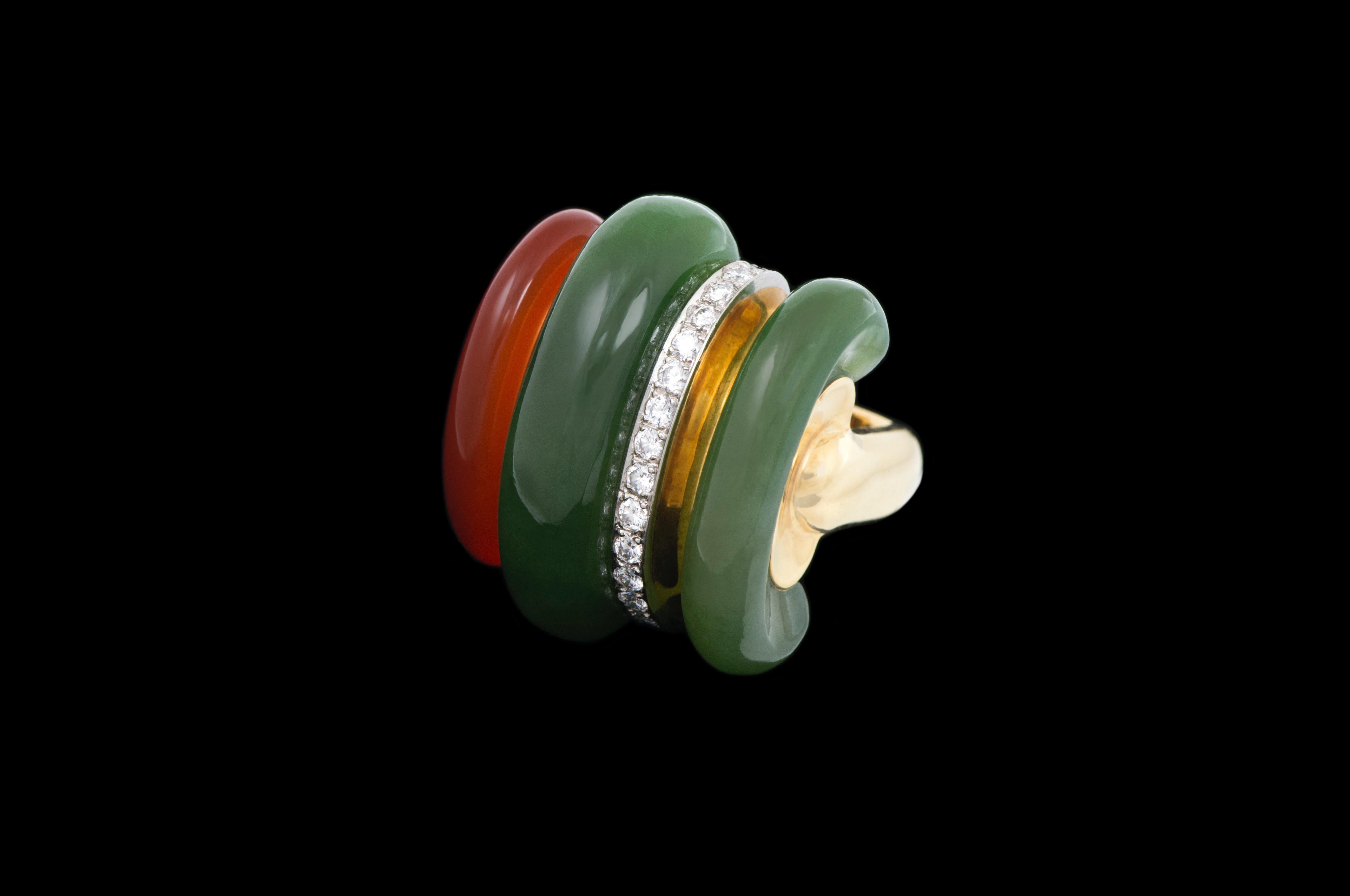 A carnelian, nephrite, diamond stripe, and 18 karat gold ring, by the Swiss firm of Gubelin, c. 1970. This unique and striking ring is a size 5 3/4. 