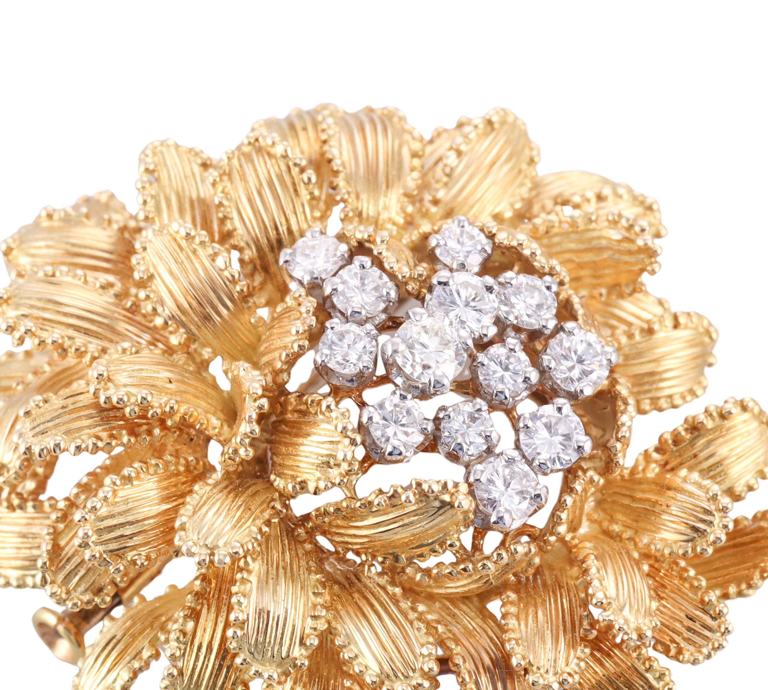 Vintage, circa 1970s Gubelin made flower brooch, set in 18k yellow gold, adorned with approximately 0.80ctw G/VS diamonds. Brooch measures 1.75