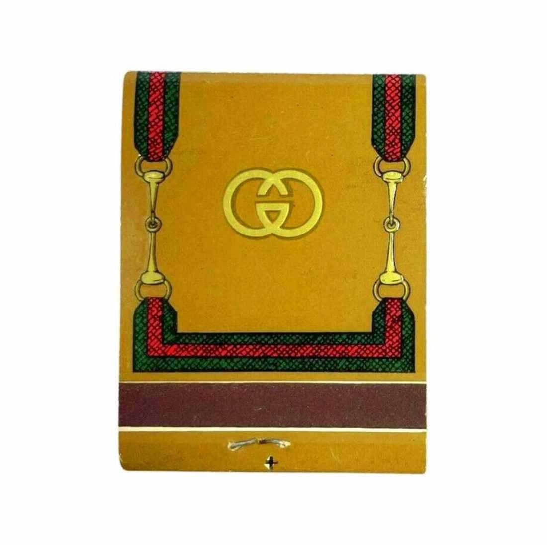 This untouched 1970s Gucci Book of Matches, boasting a lavish, dual-sided design, is a sublime reminder of the opulence of the Gucci name.

 An elegant statement piece that exudes luxury and sophistication. This matchbook, adorned with a stunning