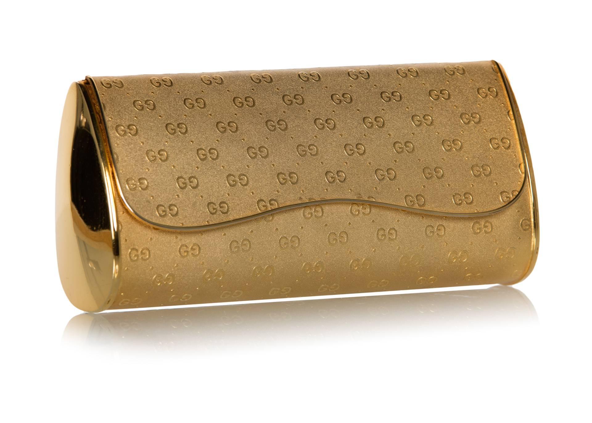 Before diamonds were a girl’s best friend, there was gold, and where there is a statement to be made, a tasteful dash of gold is sure not to disappoint. This gold metal Gucci clutch featuring their signature “GG” logo—popularized in the 1930s –
